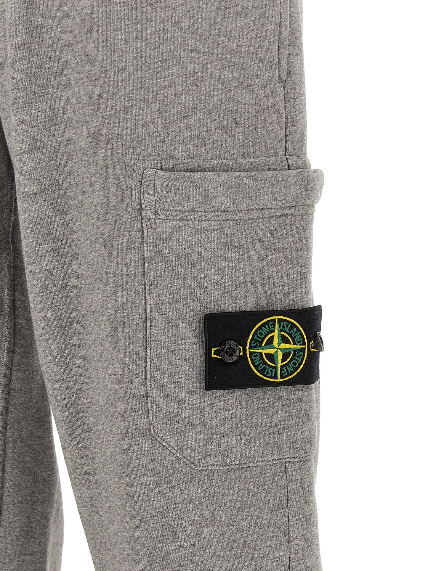 Jogger Sweatpants by Stone Island for men in cotton gray features a versatile silhouette, integrating performance with a versatile tapered-leg, long, and comfortable .