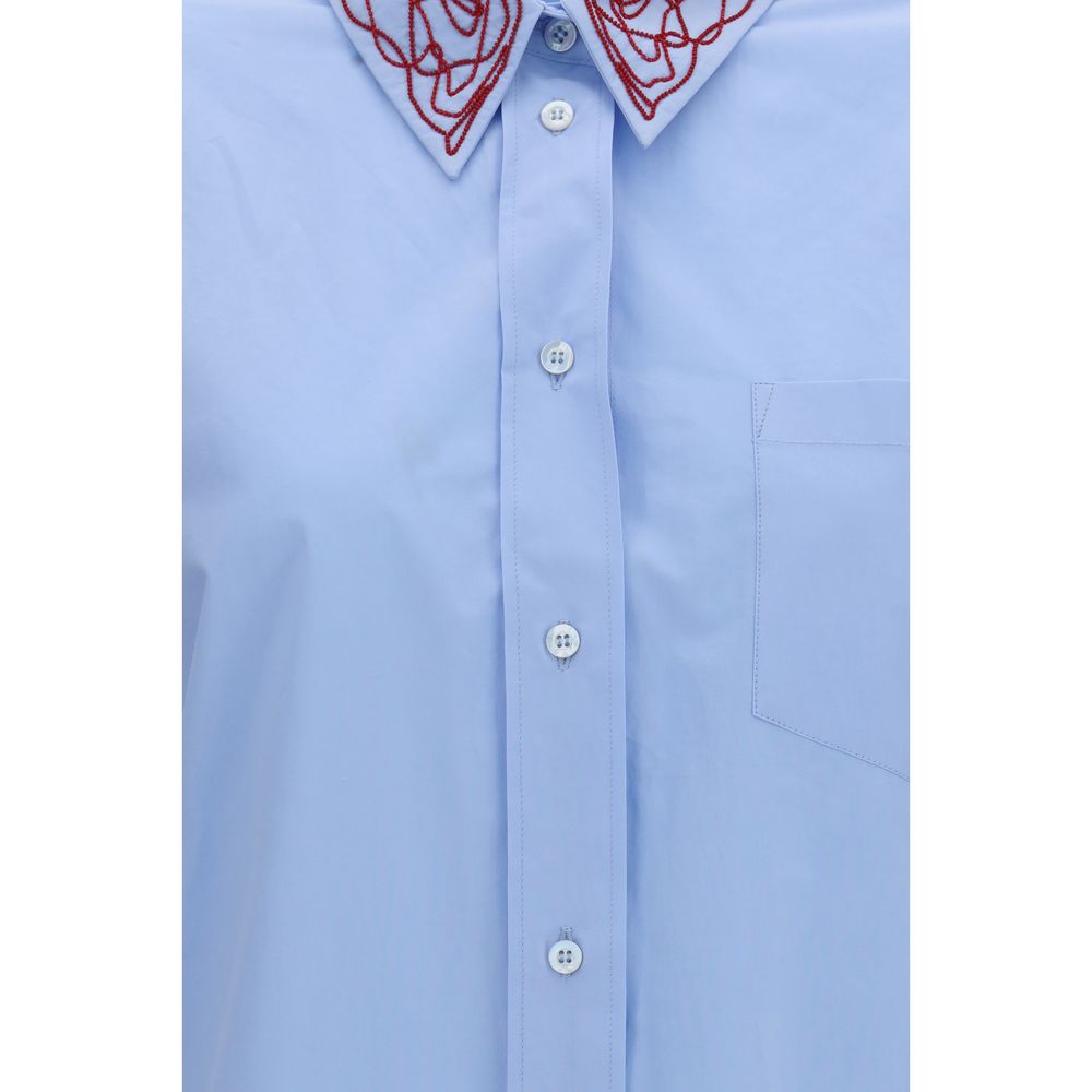 Dress Shirt by Fabiana Filippi for women in cotton blue presents a discerning silhouette, showcasing a sophisticated and for a truly discerning finish.