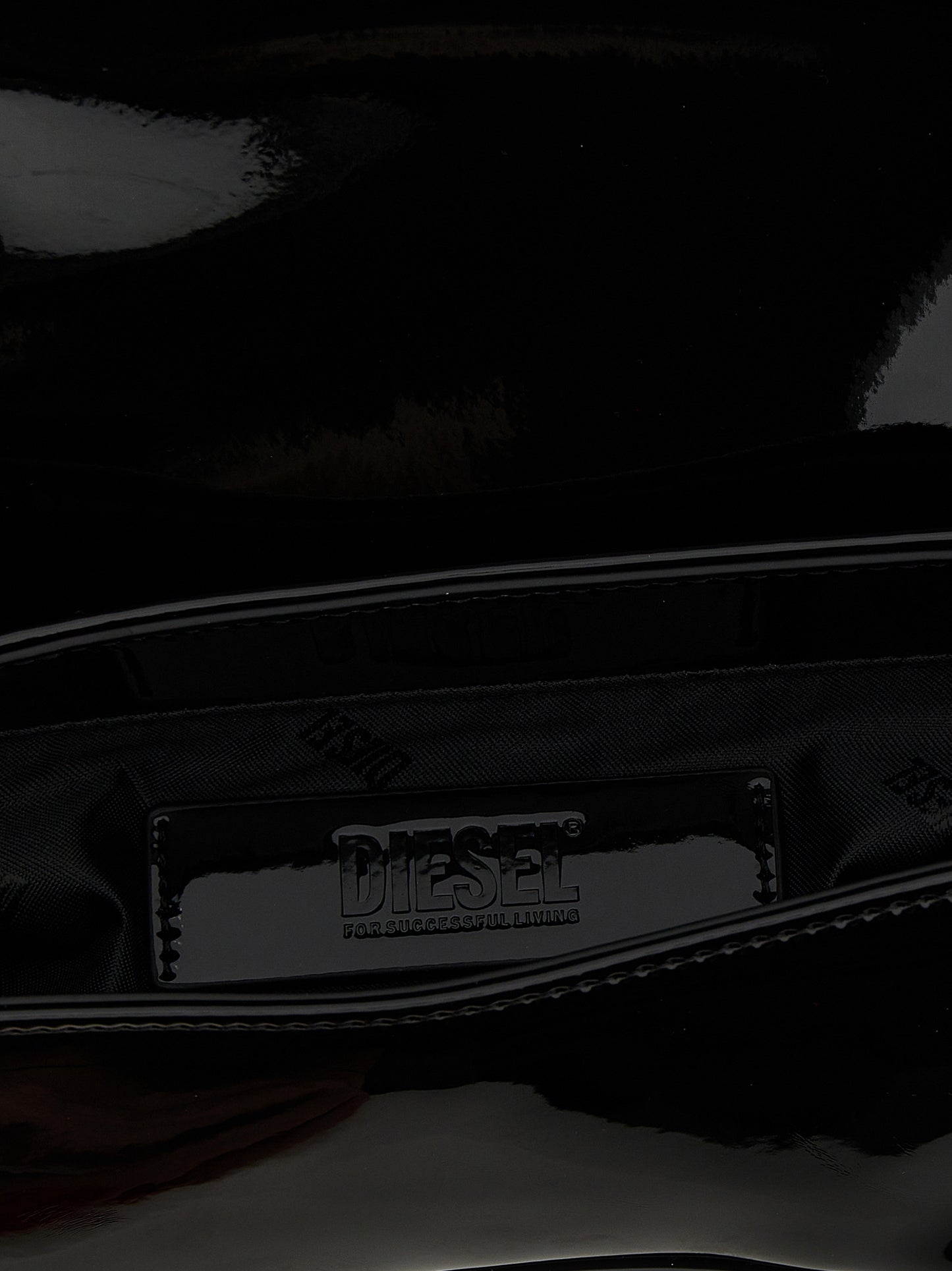2-in-1 Shoulder & Crossbody Flap Bag by Diesel for women in polyethylene & polyurethane black features a effortless sophistication silhouette, secured by a flap & magnetic with ample and versatile crossbody-strap, shoulder-strap, adjustable-strap & handle for a effortless sophistication finish.