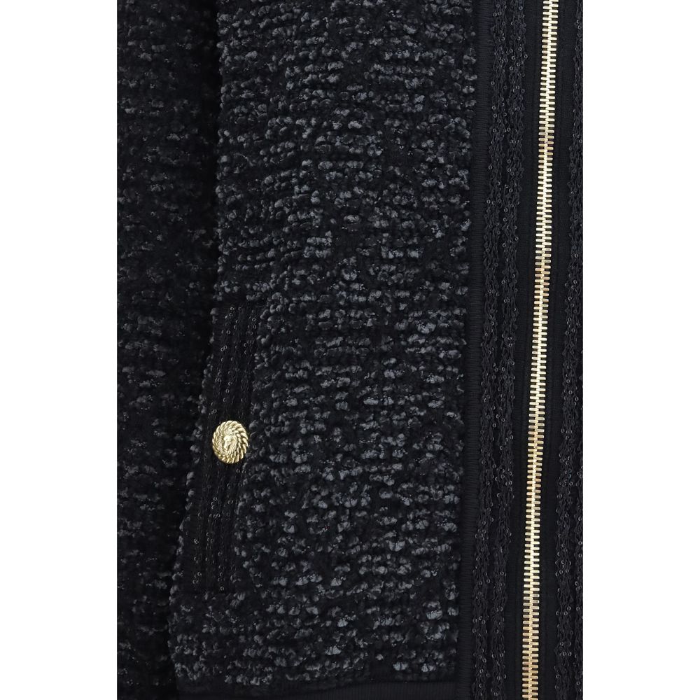 Bomber Jacket by Balmain for women in merino wool nylon polyester cotton & lyocell black presents a effortlessly chic silhouette, showcasing a sophisticated and premium pockets for a truly effortlessly chic finish.
