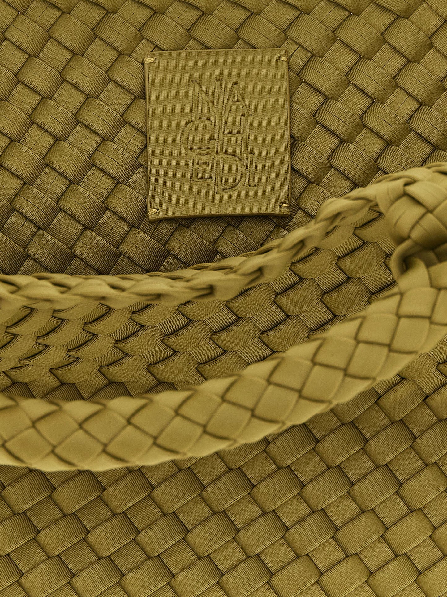 Mini Drawstring Clutch Handbag by NAGHEDI for women in nylon neoprene & calfskin leather bicolour, gold, green & signature presents a ornamental silhouette, showcasing a secure snap, flap & zipper, ample , and versatile shoulder-strap, handle & adjustable-strap for a ornamental finish.