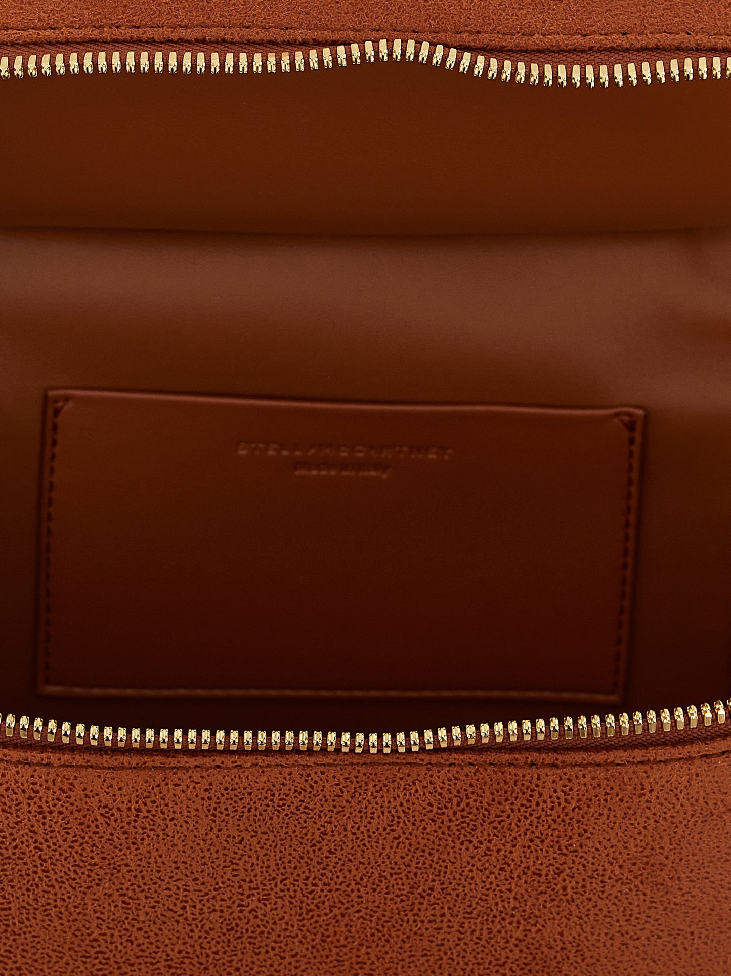 Small Crossbody Travel Tote Handbag by Stella McCartney for women in polyester suede leather gold & orange features an versatile silhouette, showcasing a secure zipper and versatile with versatile crossbody-strap, shoulder-strap & handle for a versatile finish.
