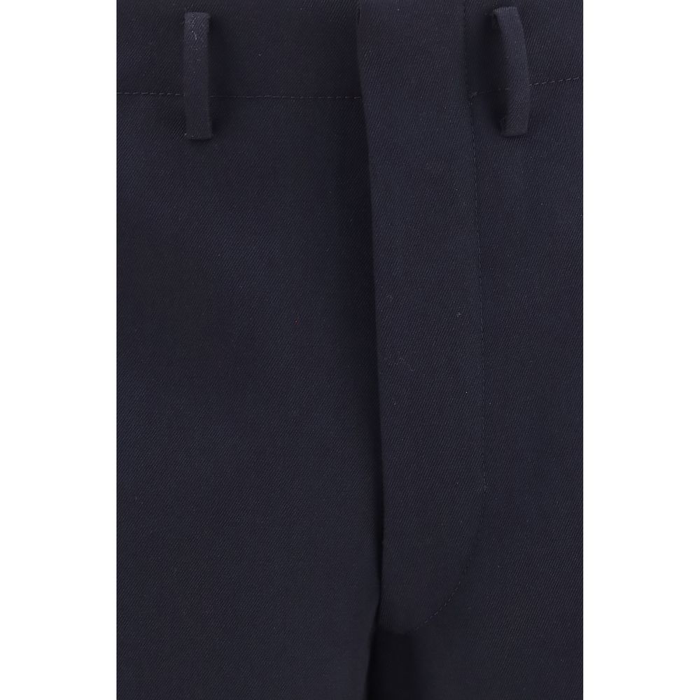 Trousers by Prada for men in wool blue presents a perennial silhouette, meticulously tailored with a regular-fit & wide cut, long finish, and an elegant high rise.