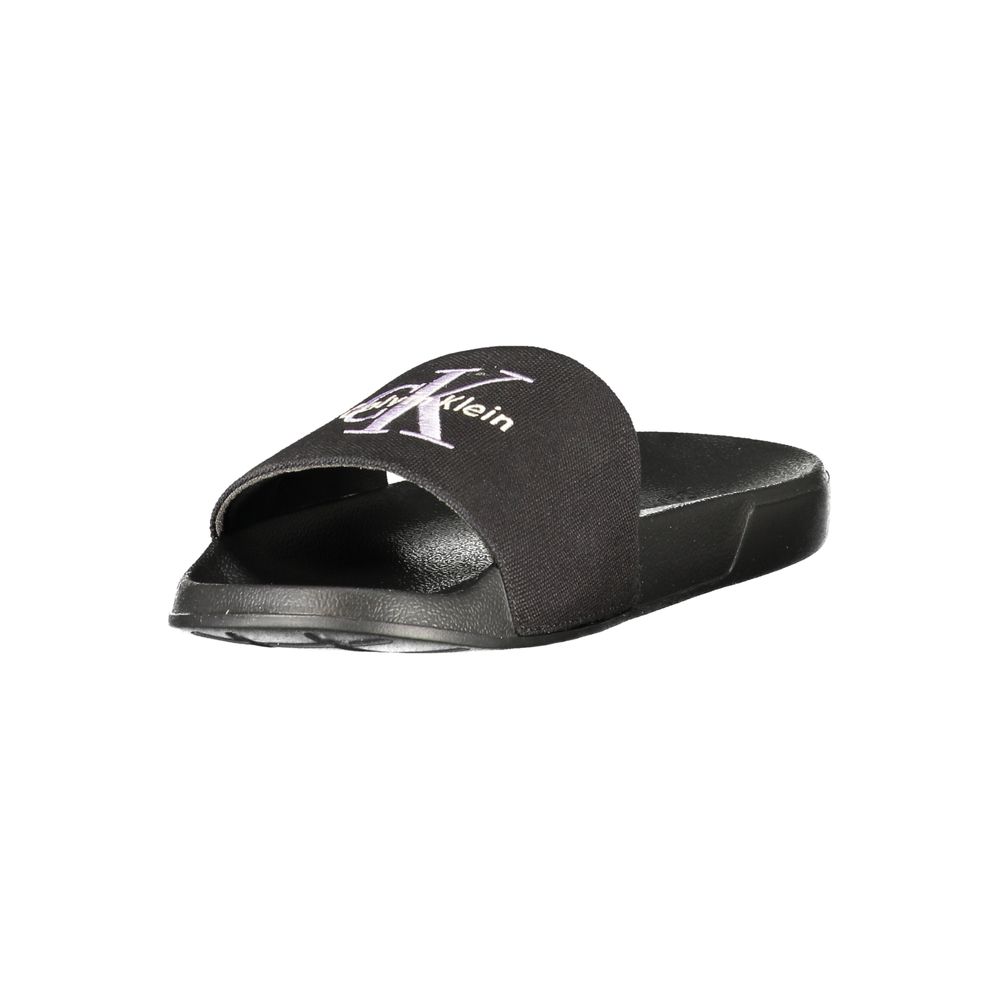 Flat Sandals by Calvin Klein for women in plush polyester polyurethane black features an architectural design from the Women's Plush Polyester Polyurethane Flat Sandals collection, defined by a architectural flat and for a architectural finish.