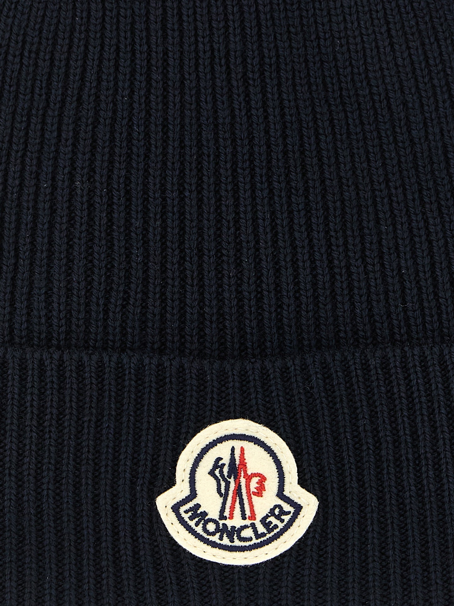 Beanie Hat by Moncler for men in virgin wool felt navy features a refined silhouette, showcasing the refined design of the Virgin Wool Felt Beanie Hat for a sophisticated look.