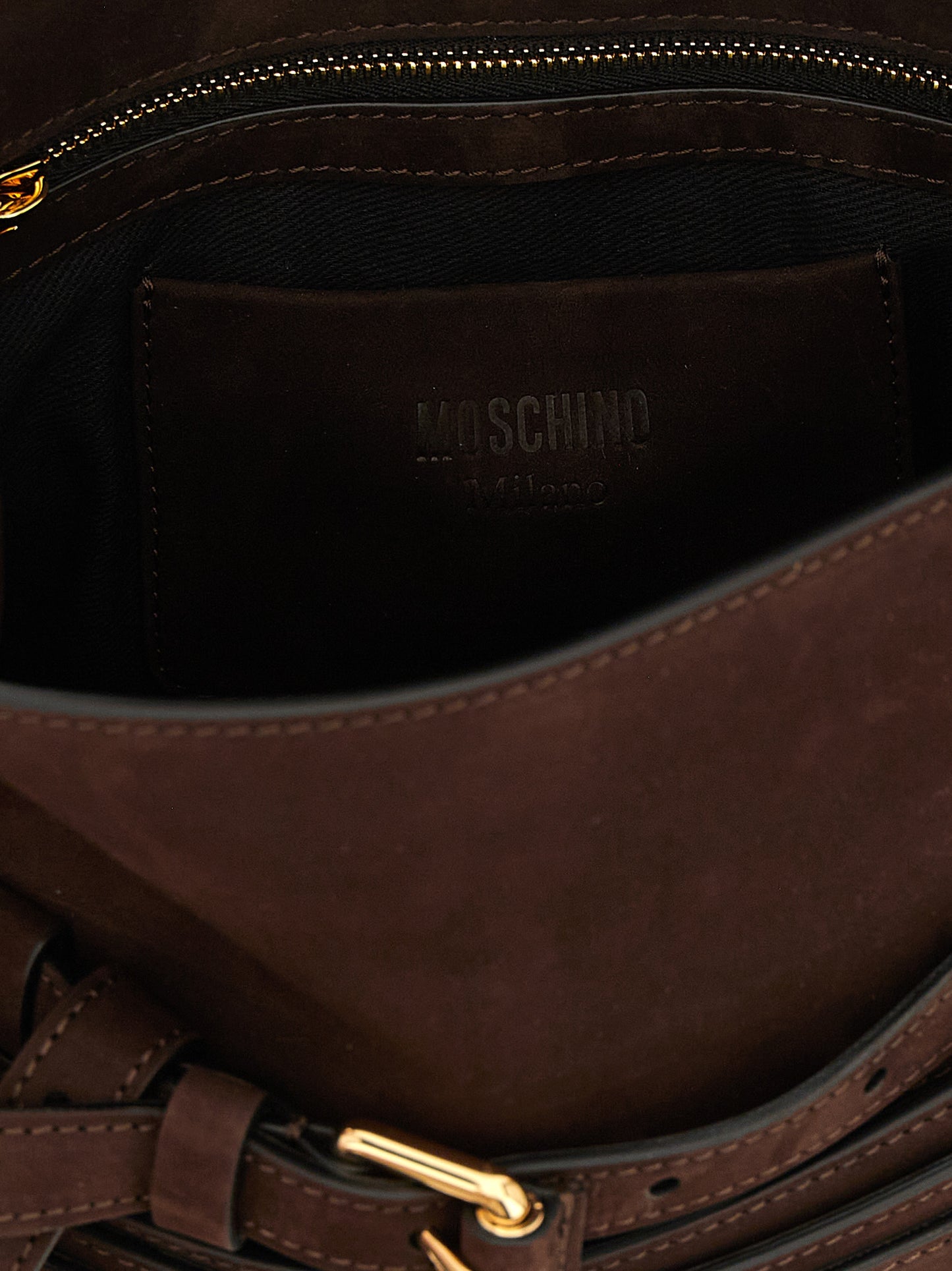 Small Shoulder Flap Handbag by Moschino for women in nubuck calfskin leather brown & gold features a contemporary silhouette, showcasing a secure flap & buckle, ample , and contemporary handle, adjustable-strap & belt-strap for a sophisticated look.