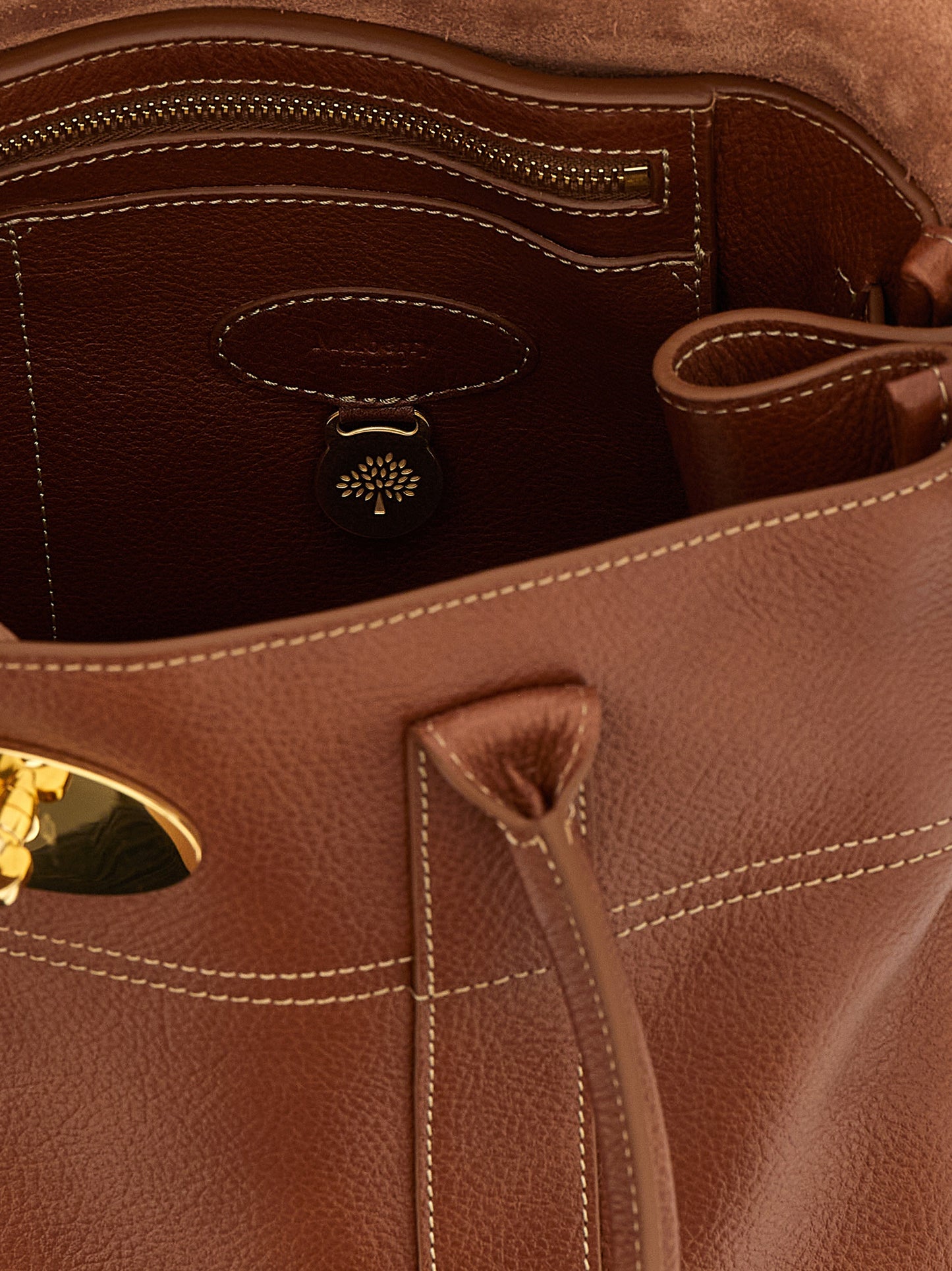 Shoulder Flap Bag by Mulberry for women in calfskin leather brown showcases a enviable silhouette, artfully detailed with a secure flap, organized , and versatile shoulder-strap, adjustable-strap & handle for a enviable look.