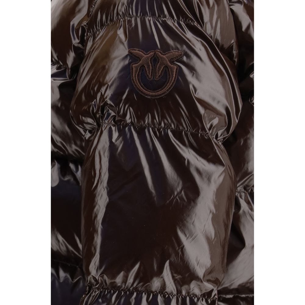 This Hooded Puffer Jacket by PINKO for women in polyamide & polyester brown exhibits a edgy silhouette, meticulously detailed with functional pockets, hooded & insulated and a edgy hooded neckline for a edgy finish.