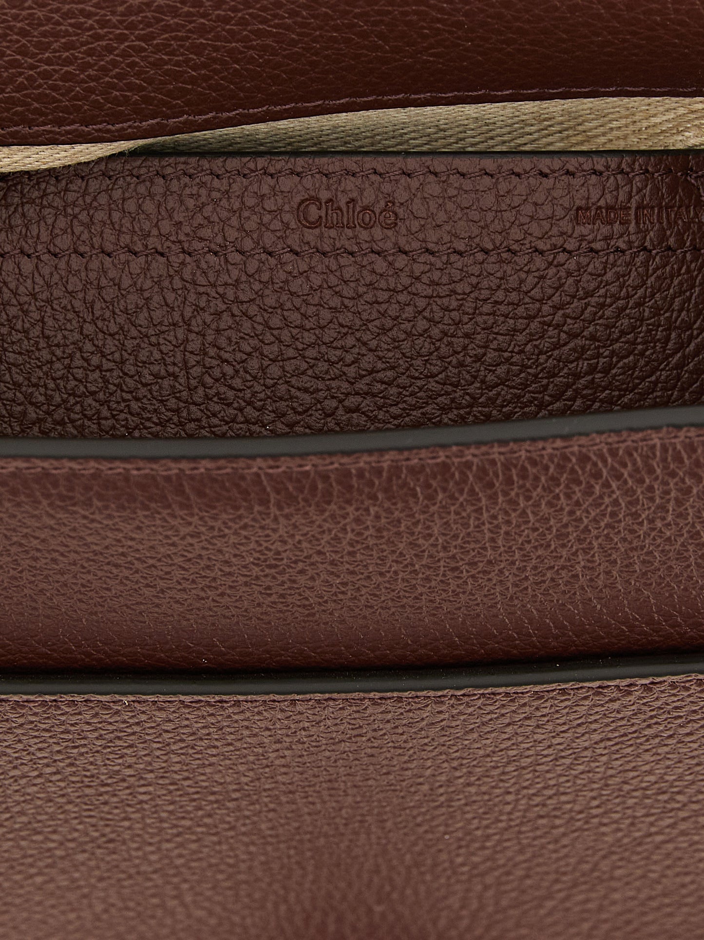 Crossbody Saddle Handbag by Chloé for women in linen & bos taurus calfskin leather brown & gold features a transformative sophistication silhouette, showcasing a secure , ample , and versatile crossbody-strap, shoulder-strap & adjustable-strap for a transformative sophistication look.