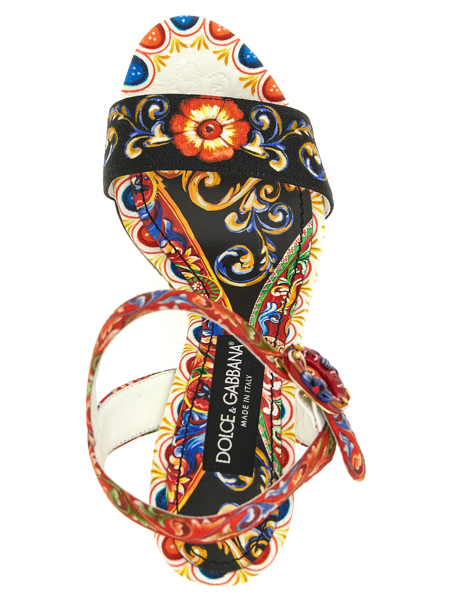 Wedge Ankle Strap Sandals by Dolce & Gabbana for women in cotton viscose & leather multicolor & print showcases a sculptural silhouette as Maiolica Women's Cotton Viscose & Leather Wedge Ankle Strap Sandals, defined by a sculptural wedge and sculptural for a sculptural look.