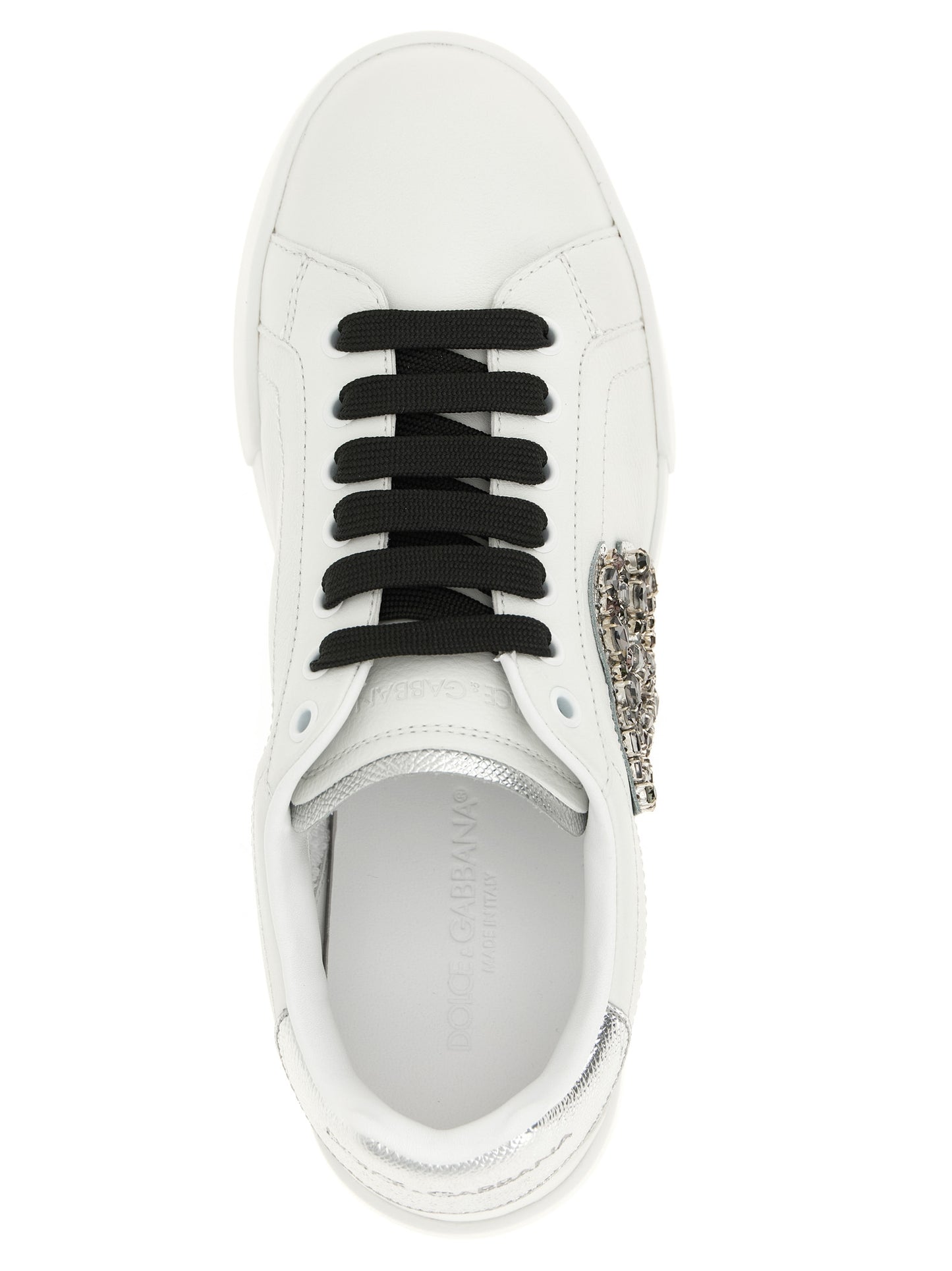 Sneakers by Dolce & Gabbana for women in dauphine calfskin leather black & silver presents a sumptuous silhouette, artfully capturing the essence of the Women's Low Top Dauphine Calfskin Leather Sneakers with its sumptuous low-top style design.