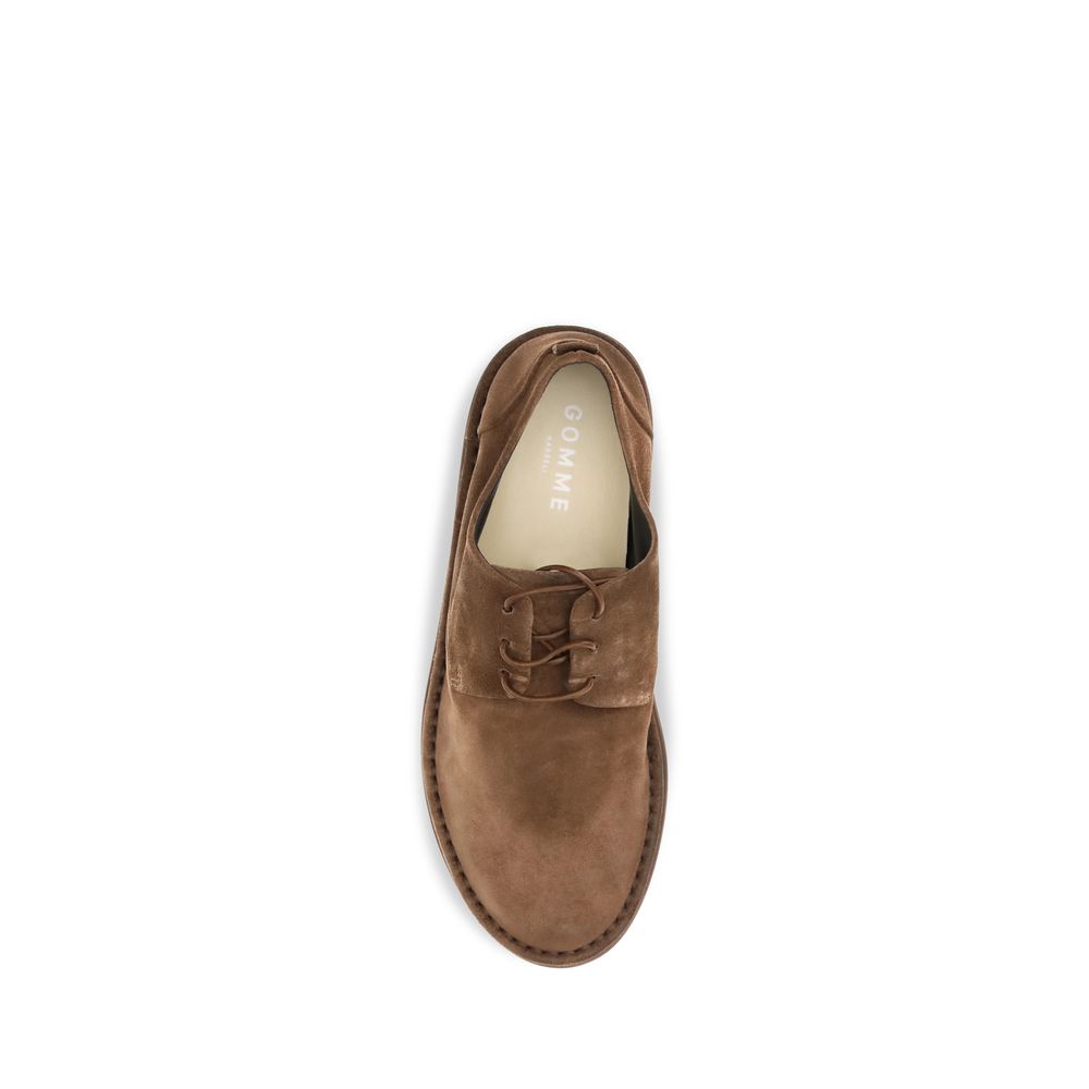 Derby Lace-Up Shoes by Marsell for men in bos taurus calf suede leather brown showcases a timeless silhouette from the Men's Bos Taurus Calf Suede Leather Derby Lace-Up Shoes collection, featuring a timeless and round toe style for a timeless finish.