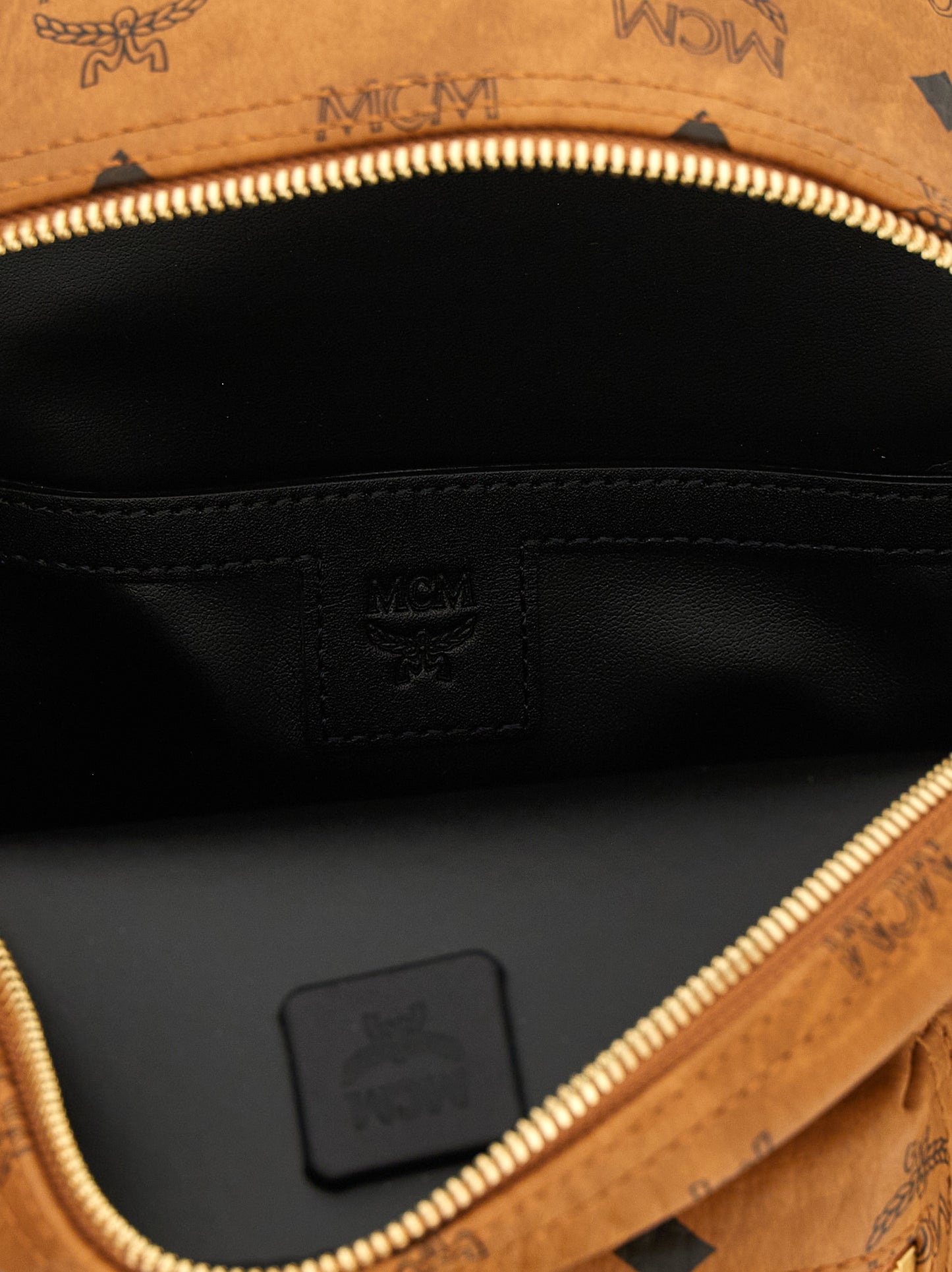Mini Backpack by MCM for women in nappa polyester polyethylene polyurethane leather brown, gold & monogram features a fashionable silhouette, showcasing the Visetos Nappa Polyester Polyethylene Polyurethane Leather Mini Backpack design with a secure , ample , and versatile backpack-strap & adjustable-strap.