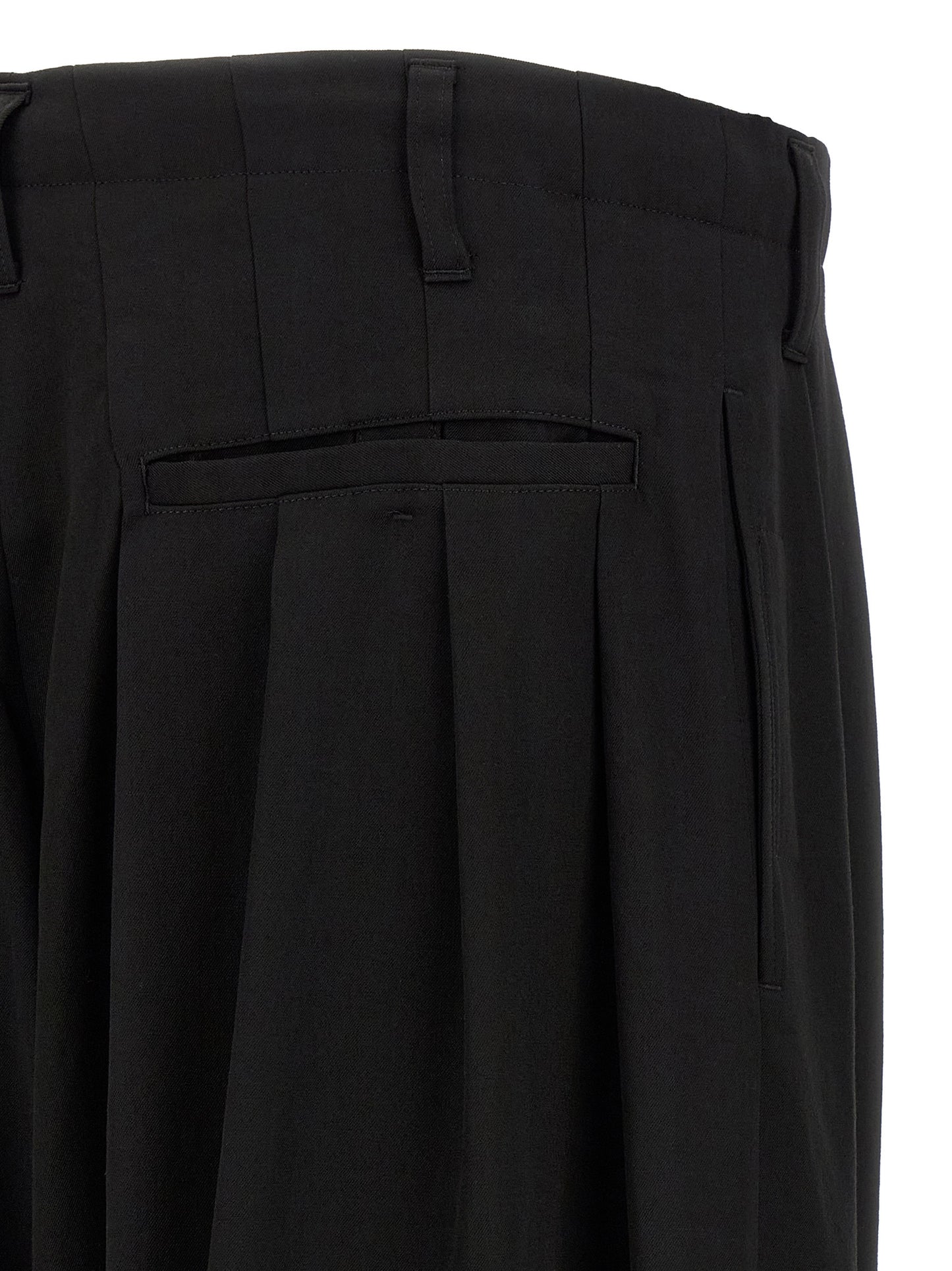 Trousers by Yohji Yamamoto for men in wool black features a artisanal silhouette, showcasing a sophisticated wide with a long and for a artisanal finish.