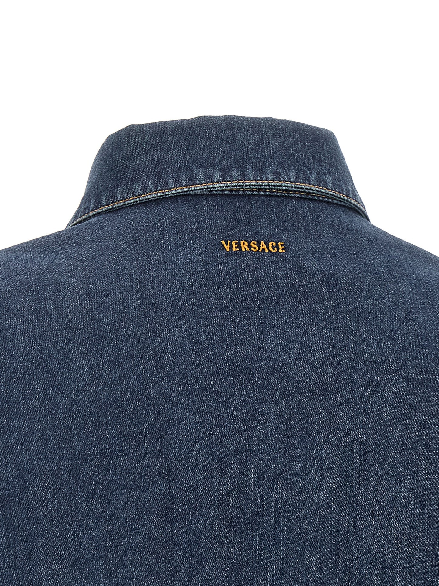 Dress by Versace for women in denim cotton blue showcases a striking silhouette, elegantly detailed with a , refined , and a striking short mini for a striking finish.