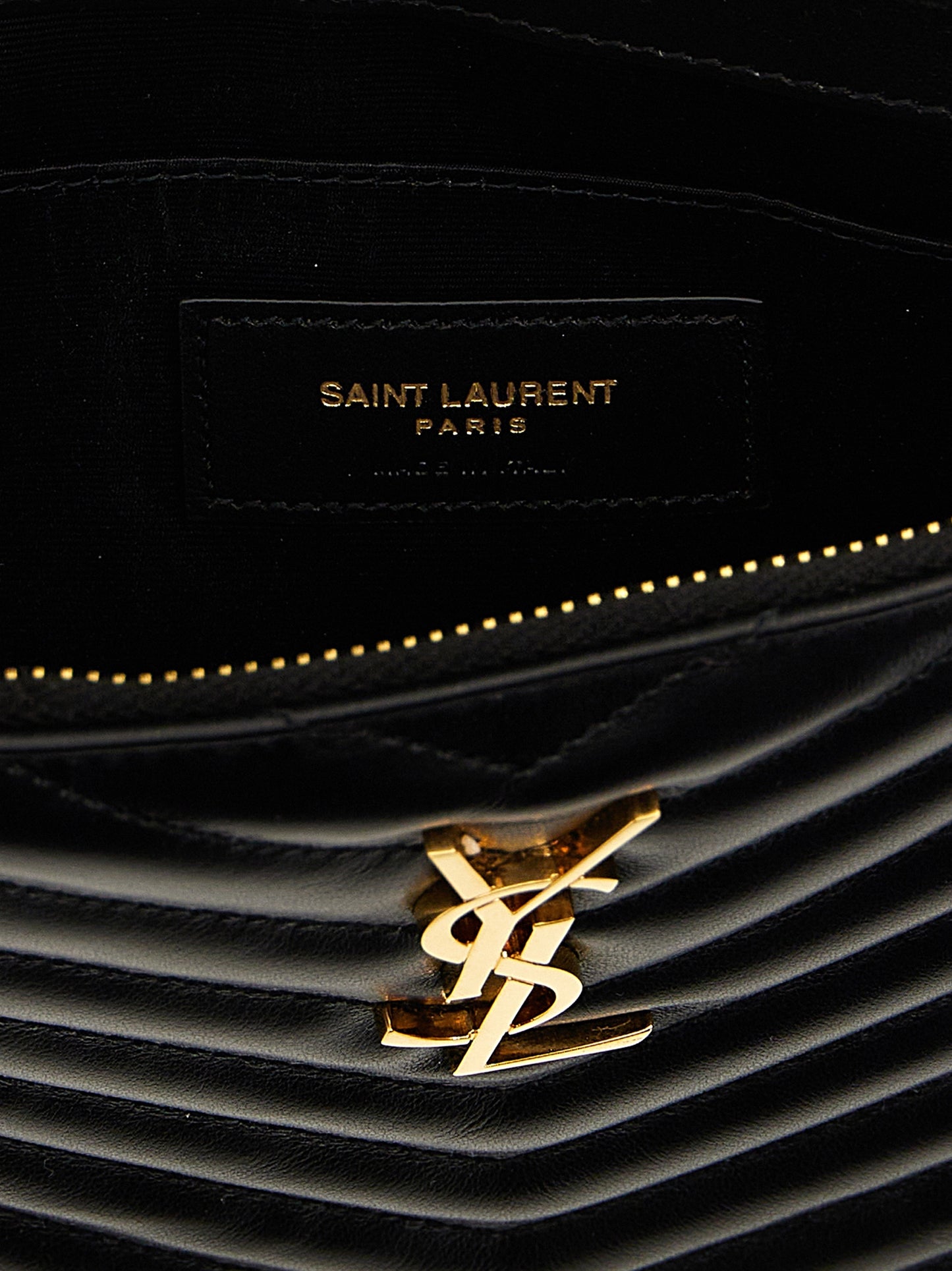 Clutch Handbag by Saint Laurent for women in calfskin leather black features a architectural silhouette, showcasing a secure zipper, ample , and versatile wristlet & handle for a architectural finish.