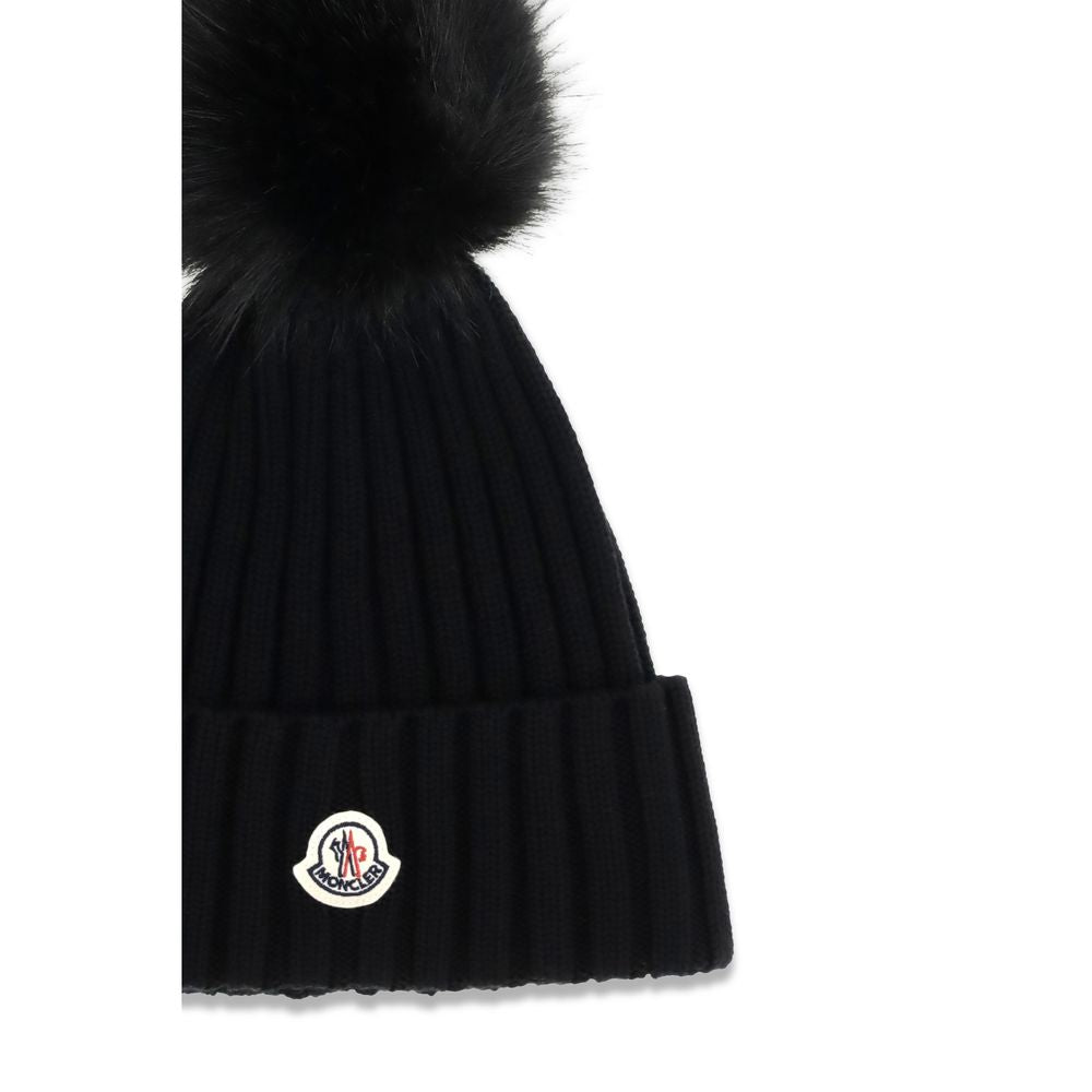 Beanie Hat by Moncler for women in virgin wool black presents a urban-chic silhouette, artfully capturing the essence of the urban-chic Virgin Wool Beanie Hat design for a sophisticated look.