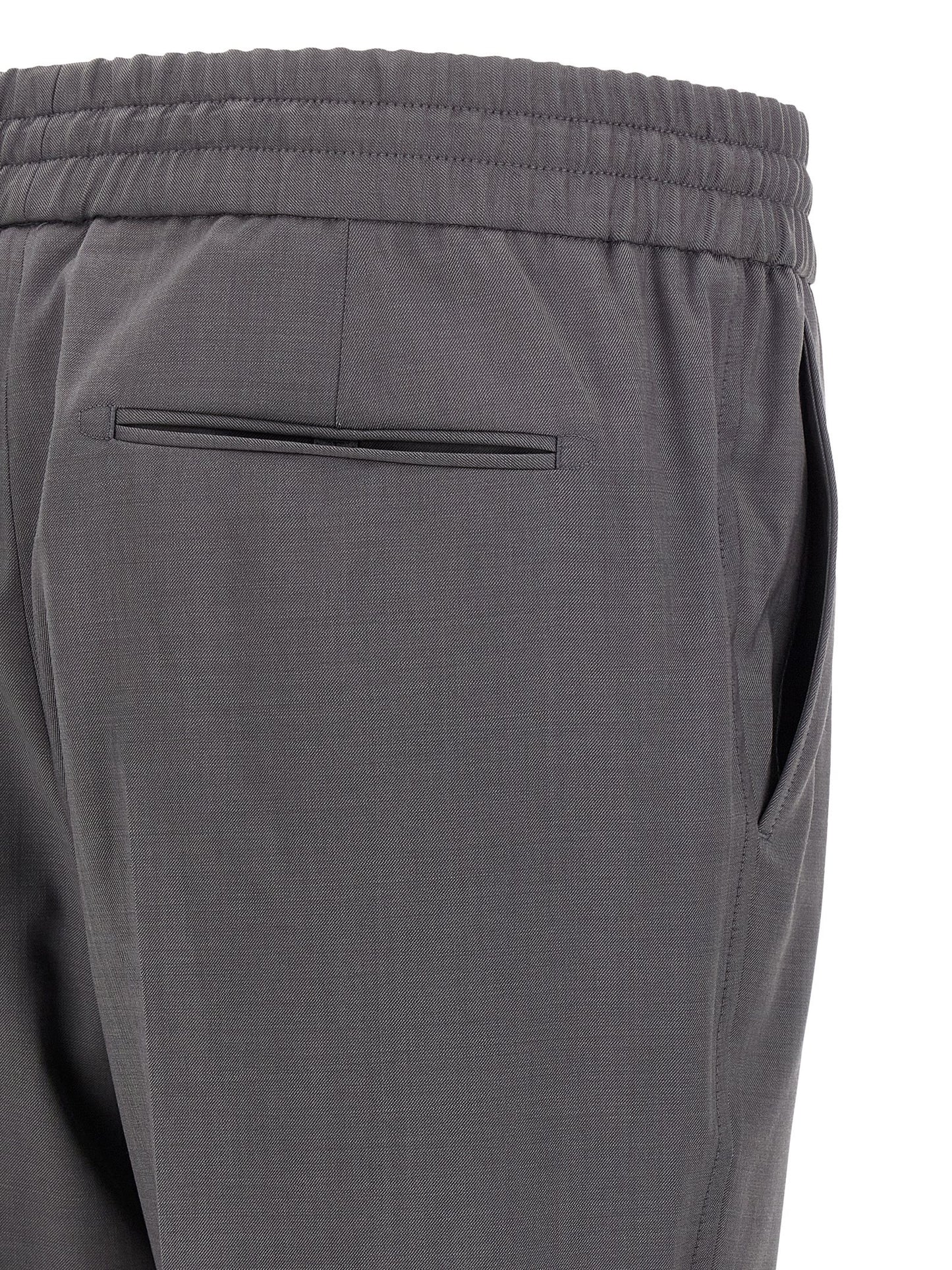 Trousers by Brioni for men in wool gray features a artisanal silhouette, showcasing a sophisticated straight-leg with a long and for a artisanal finish.