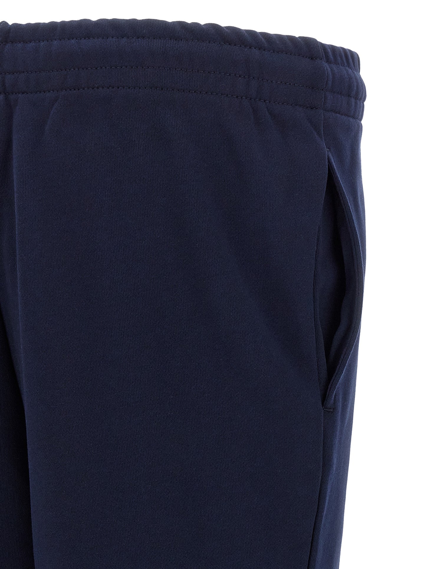 Joggers by Lacoste for men in crocodile skin leather & cotton navy features an sartorial and long with a cut for a sartorial finish.