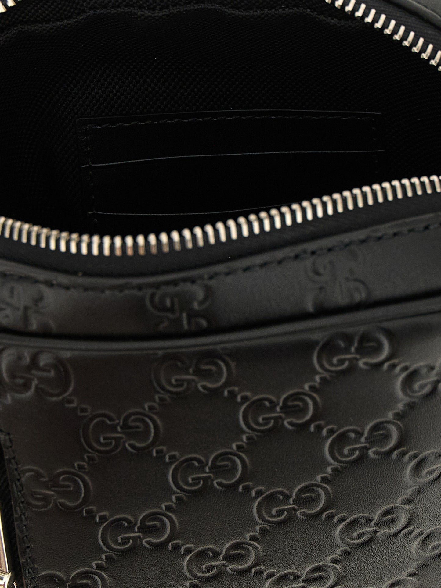 2-in-1 Shoulder & Crossbody Messenger Bag by Gucci for men in bos taurus calfskin leather black & patterned showcases a stylish Gg Bos Taurus Calfskin Leather 2-in-1 Shoulder & Crossbody Messenger Bag design, featuring a secure zipper and ample with versatile crossbody-strap, shoulder-strap & adjustable-strap for a stylish look.