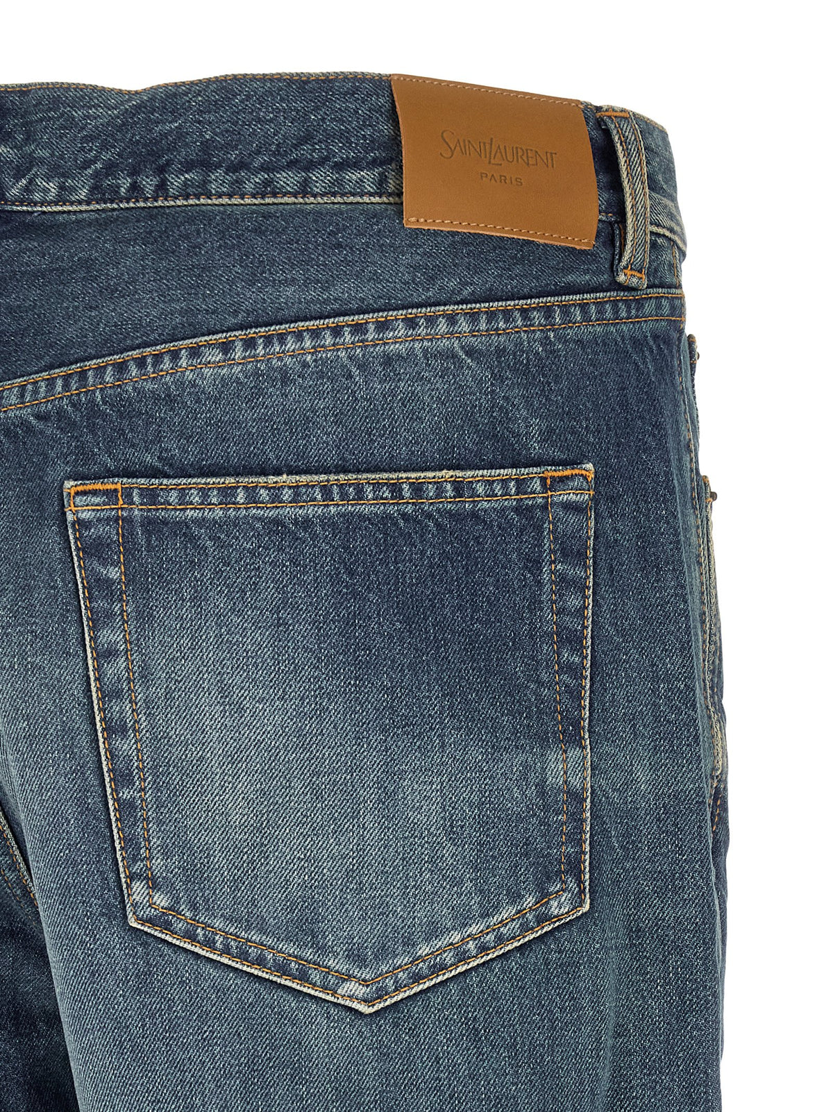 Jeans by Saint Laurent for men in cotton denim blue features a polished silhouette with a polished straight-leg & wide, reaching a polished long and finished with a polished mid rise.