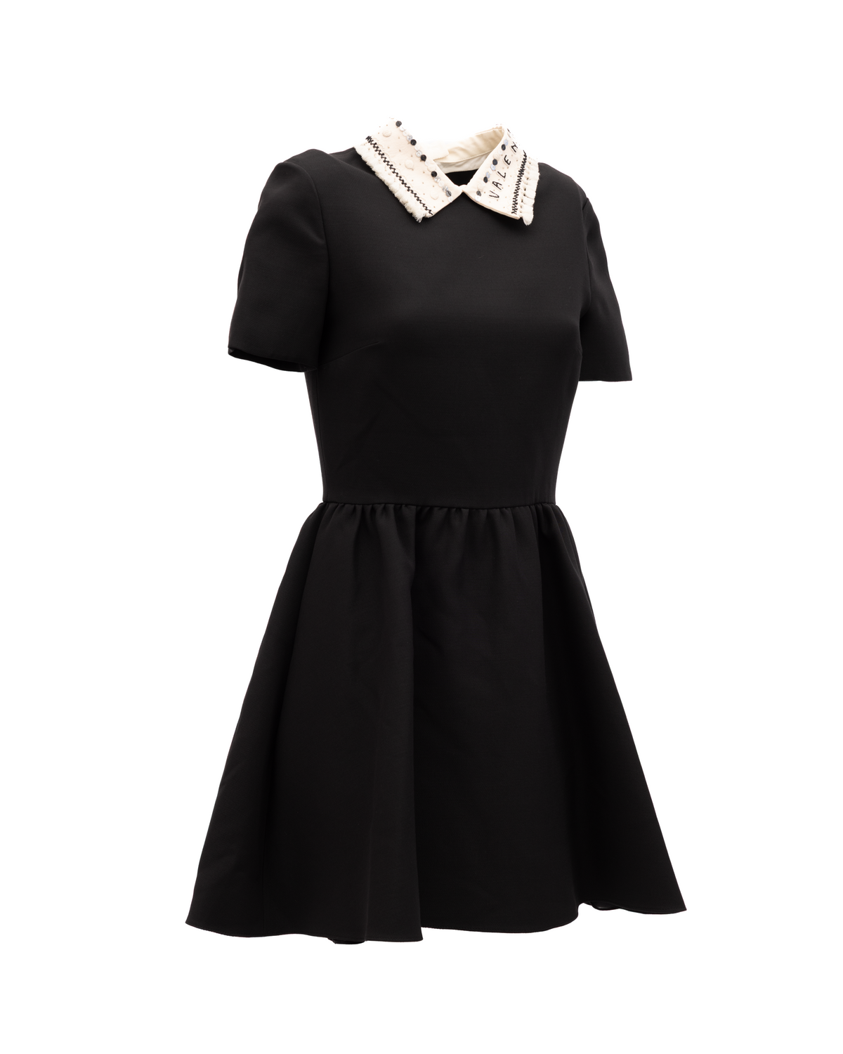 Dress by Valentino Garavani for women in tweed black & white features an eye catching silhouette with a sophisticated , elegant , and a refined short mini for a eye catching aesthetic.