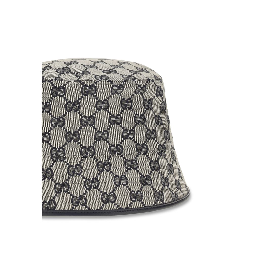 This Bucket Hat by Gucci for women in polyamide polyester leather & cotton canvas gray presents a effortlessly chic silhouette, showcasing the refined aesthetic and effortlessly chic craftsmanship of the Gg Polyamide Polyester Leather & Cotton Canvas Bucket Hat.