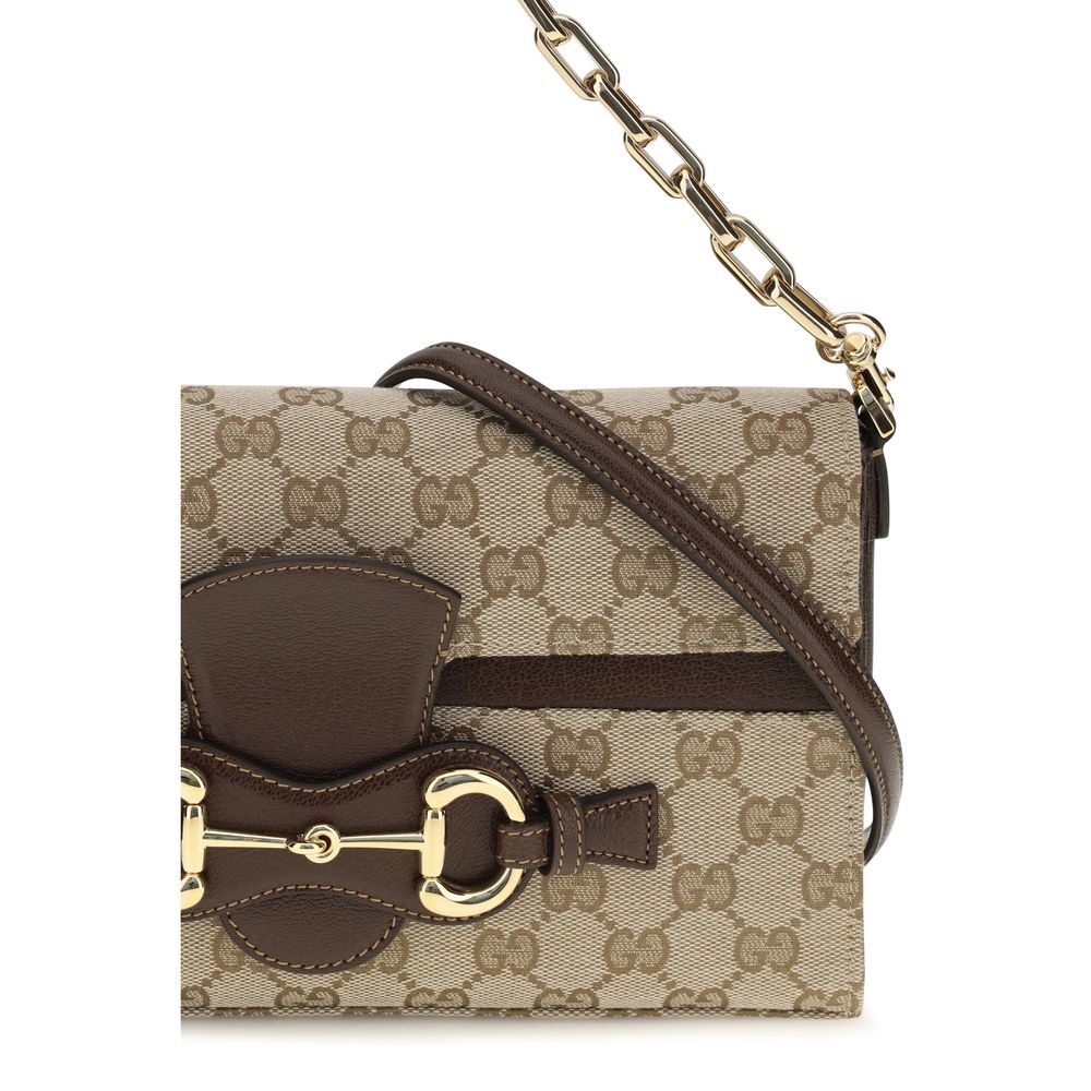 Compact Crossbody Flap Clutch Shoulder Bag by Gucci for women in leather & canvas beige, brown & gold features a distinguished silhouette, showcasing a secure flap & zipper and distinguished with versatile crossbody-strap, shoulder-strap, adjustable-strap & detachable-strap for a distinguished finish.