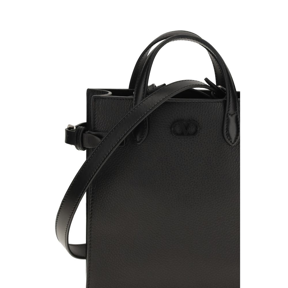 Small 2-in-1 Shoulder & Crossbody Bag by Valentino Garavani for men in bos taurus grained & suede calf leather black & palladium features a effortless chic silhouette with a secure , ample , and versatile crossbody-strap, shoulder-strap, adjustable-strap & handle for a effortless chic finish.