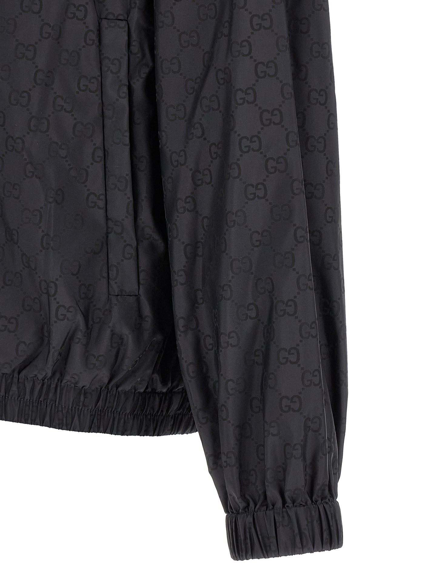 Hooded Windbreaker Jacket by Gucci for men in polyamide black, silver & monogram features an perennial silhouette with a refined and perennial pockets, hooded & windproof for a sophisticated weather-resistant look.