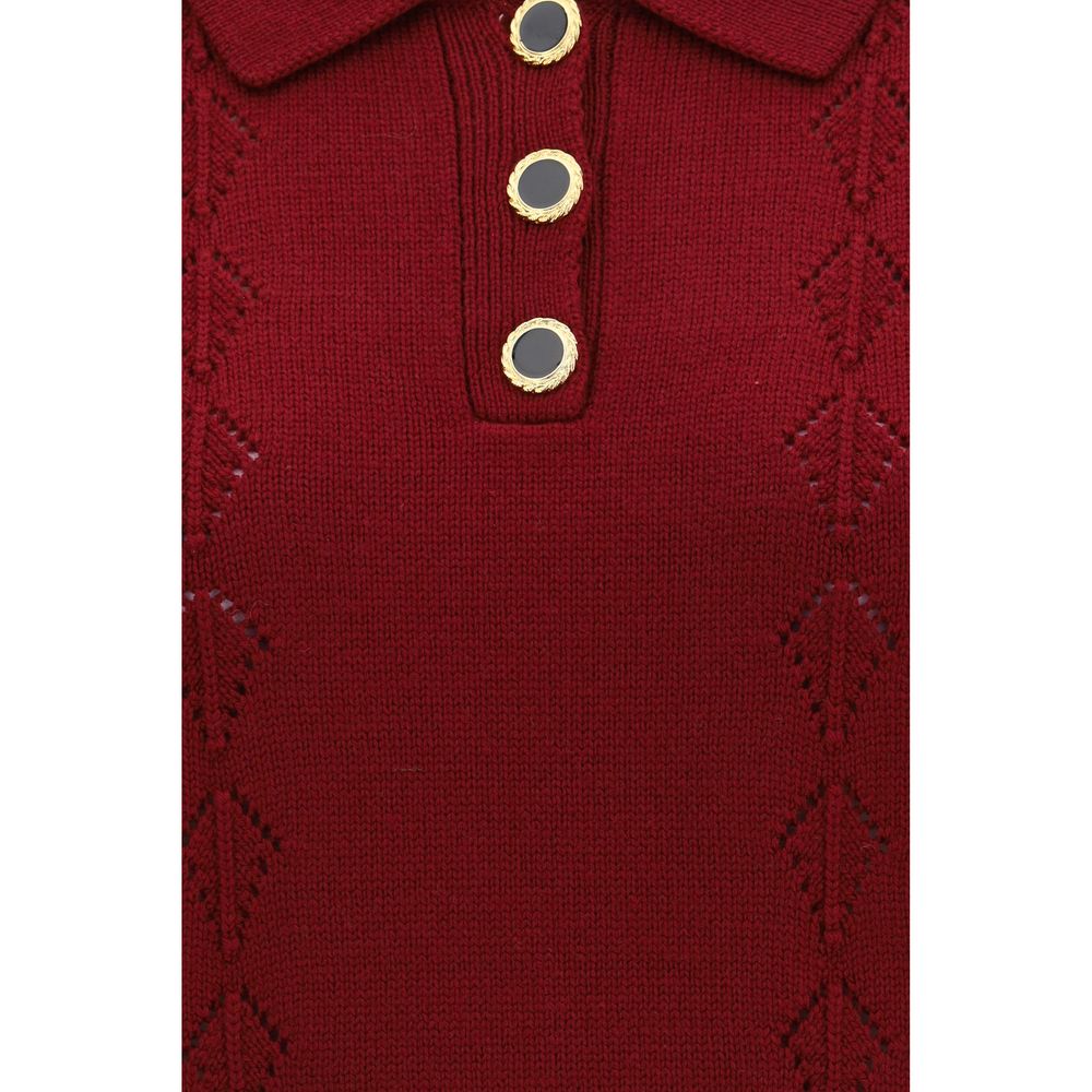 This Polo Shirt by Alessandra Rich for women in merino wool bordeaux & gold presents a flawless silhouette, showcasing flawless detailing and a refined for a truly flawless aesthetic.