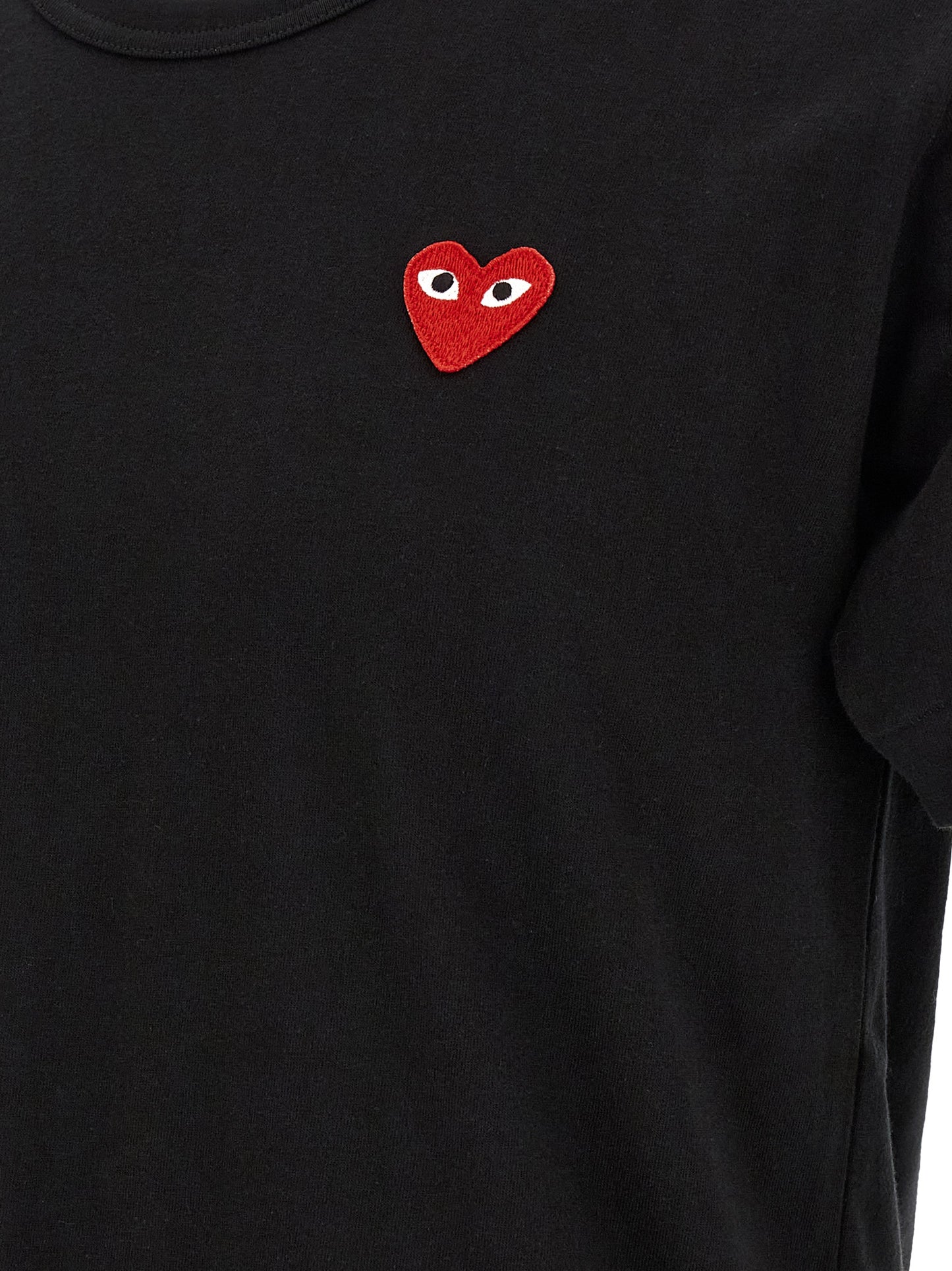T-Shirt by Comme Des Garçons Play for men in cotton black & red showcases a unassuming silhouette, artfully detailed with a refined and unassuming for a sophisticated, contemporary look.