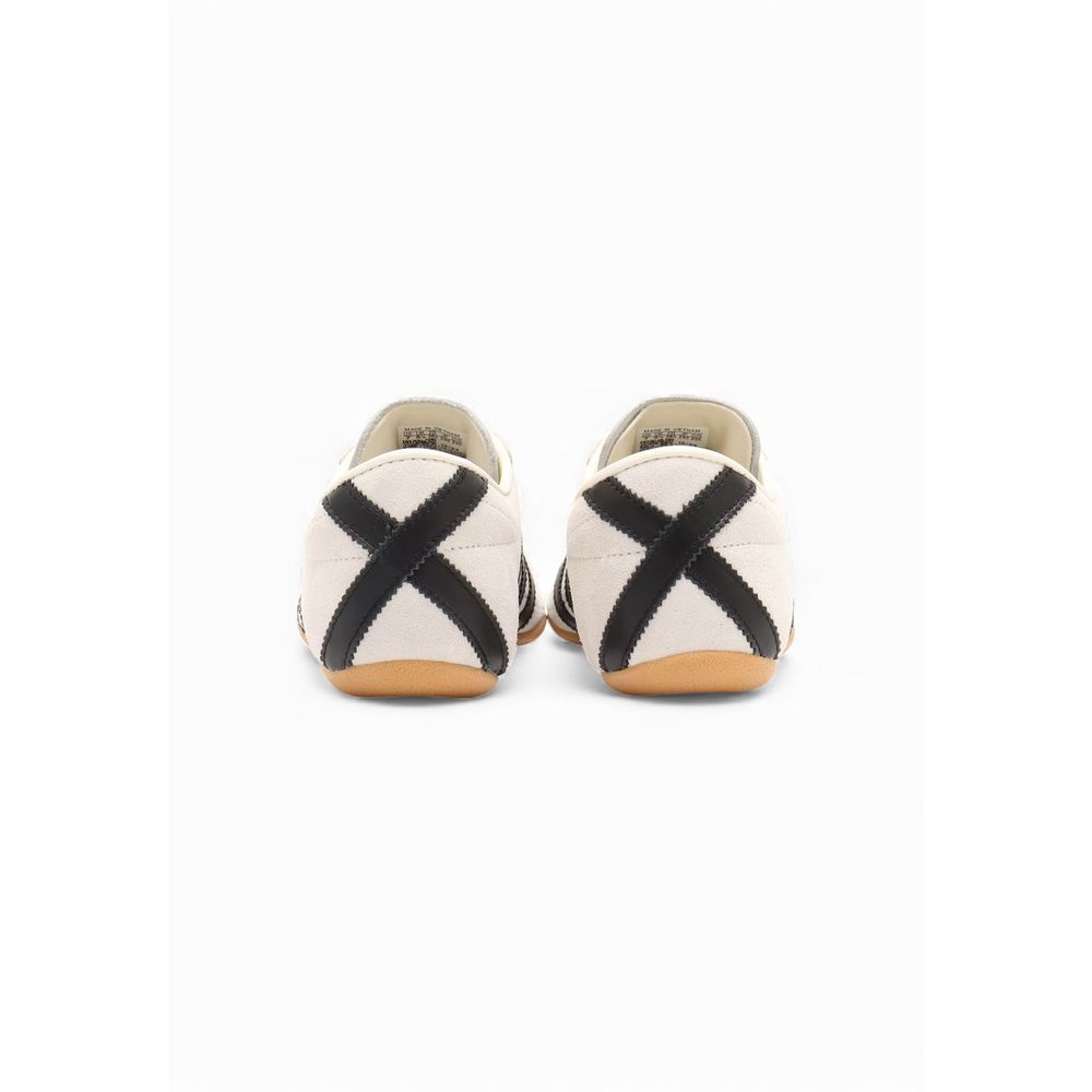 Athletic Sneakers by Adidas Originals for women in suede leather & rubber black, white & striped features an exquisite silhouette, showcasing the premium athletic style of the Women's Athletic Suede Leather & Rubber Sneakers with an exquisite finish.