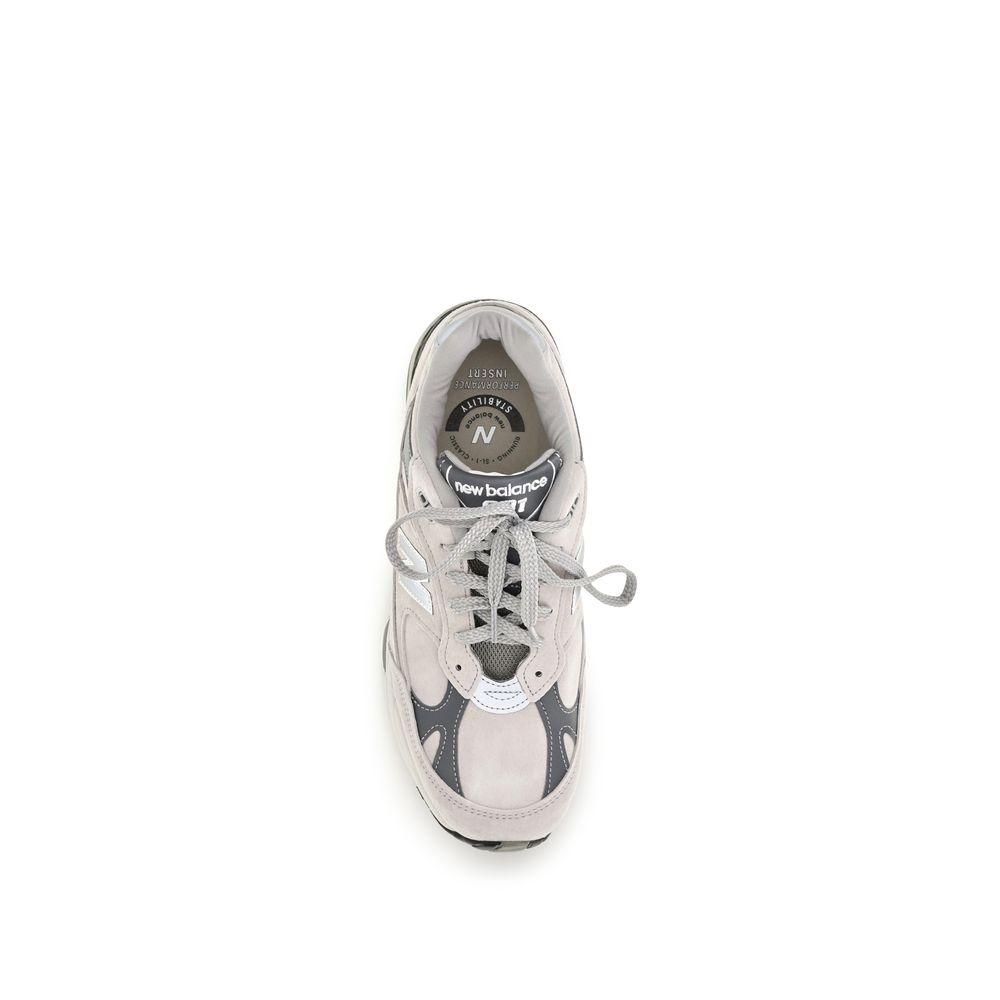 Athletic Sneakers by New Balance for men in nylon suede leather gray showcases a architectural silhouette, artfully capturing the essence of the Men's Athletic Nylon Suede Leather Sneakers with its signature architectural athletic style construction.