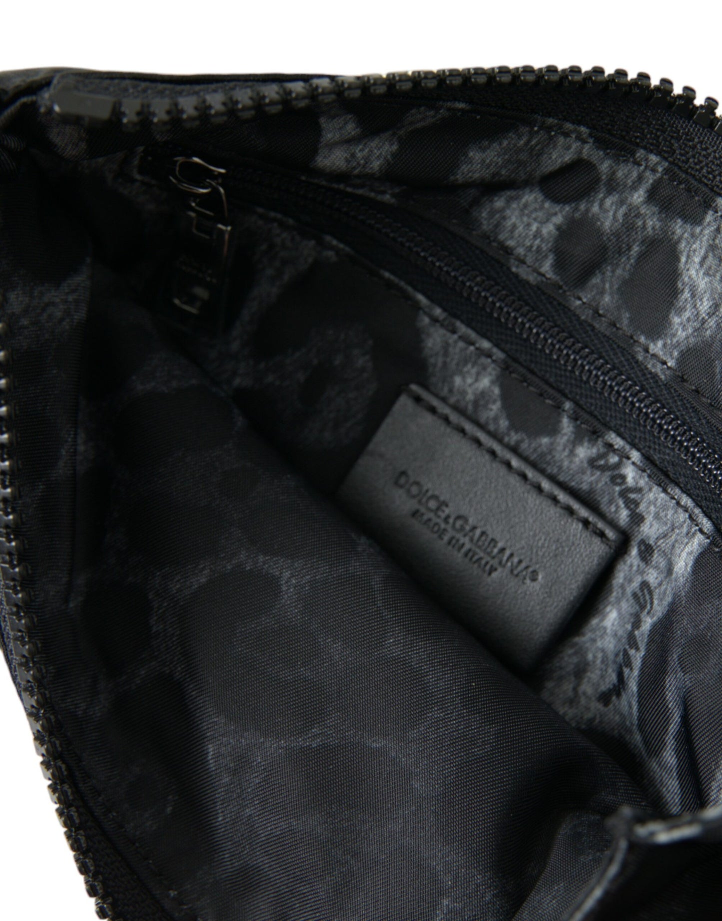 Pouch Clutch Handbag by Dolce & Gabbana for men in calfskin leather & nylon black, gold & silver showcases a sculptural silhouette, featuring a secure zipper, ample , and versatile for a sculptural aesthetic.