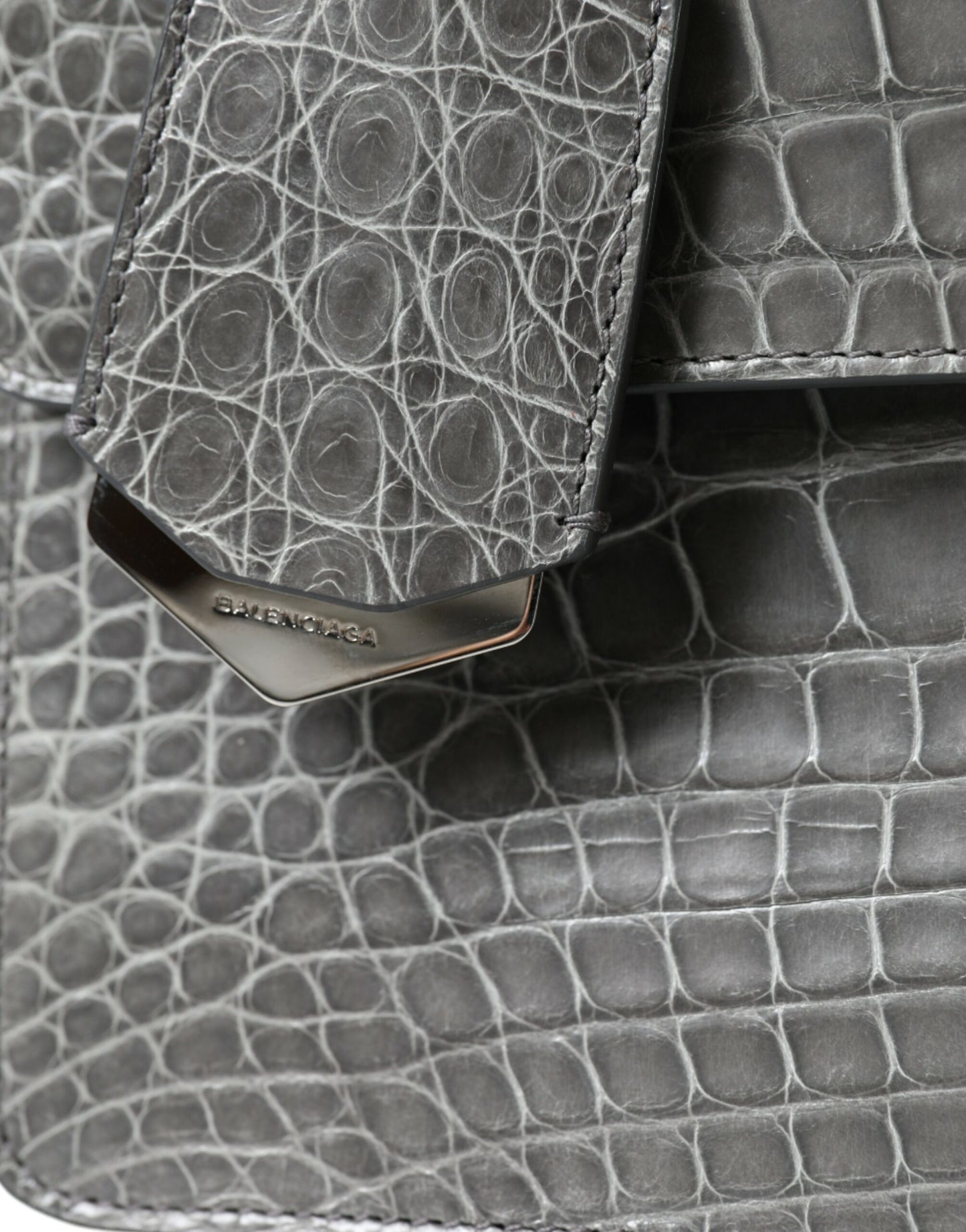 Medium Shoulder Bag by Balenciaga for women in alligator skin leather gray features a effortless sophistication silhouette, secured by a magnetic with ample and versatile shoulder-strap, adjustable-strap, detachable-strap & handle for a effortless sophistication finish.