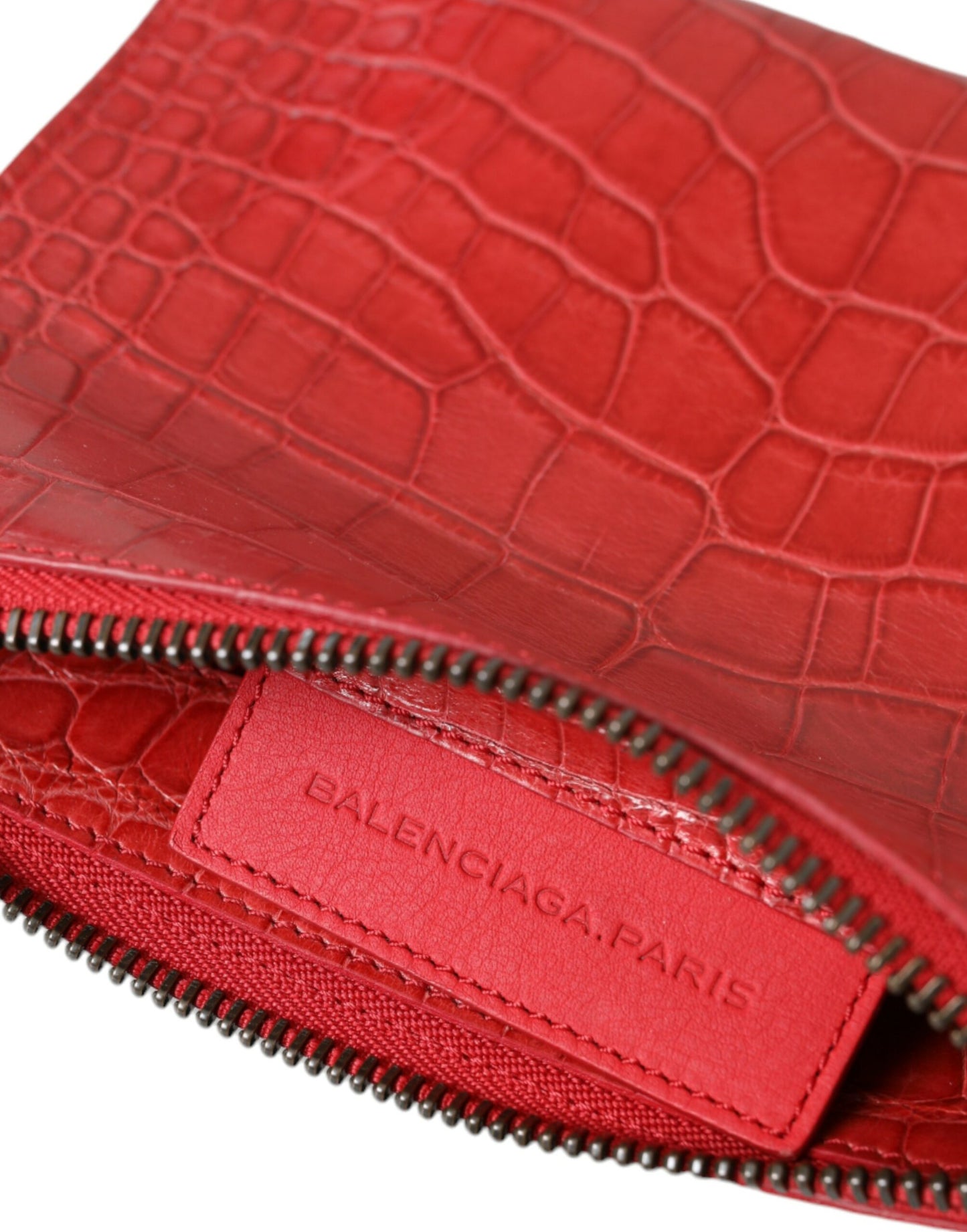 Compact Clutch Handbag by Balenciaga for women in alligator skin leather red features a sculptural silhouette with a secure zipper, organized , and versatile for a sculptural finish.