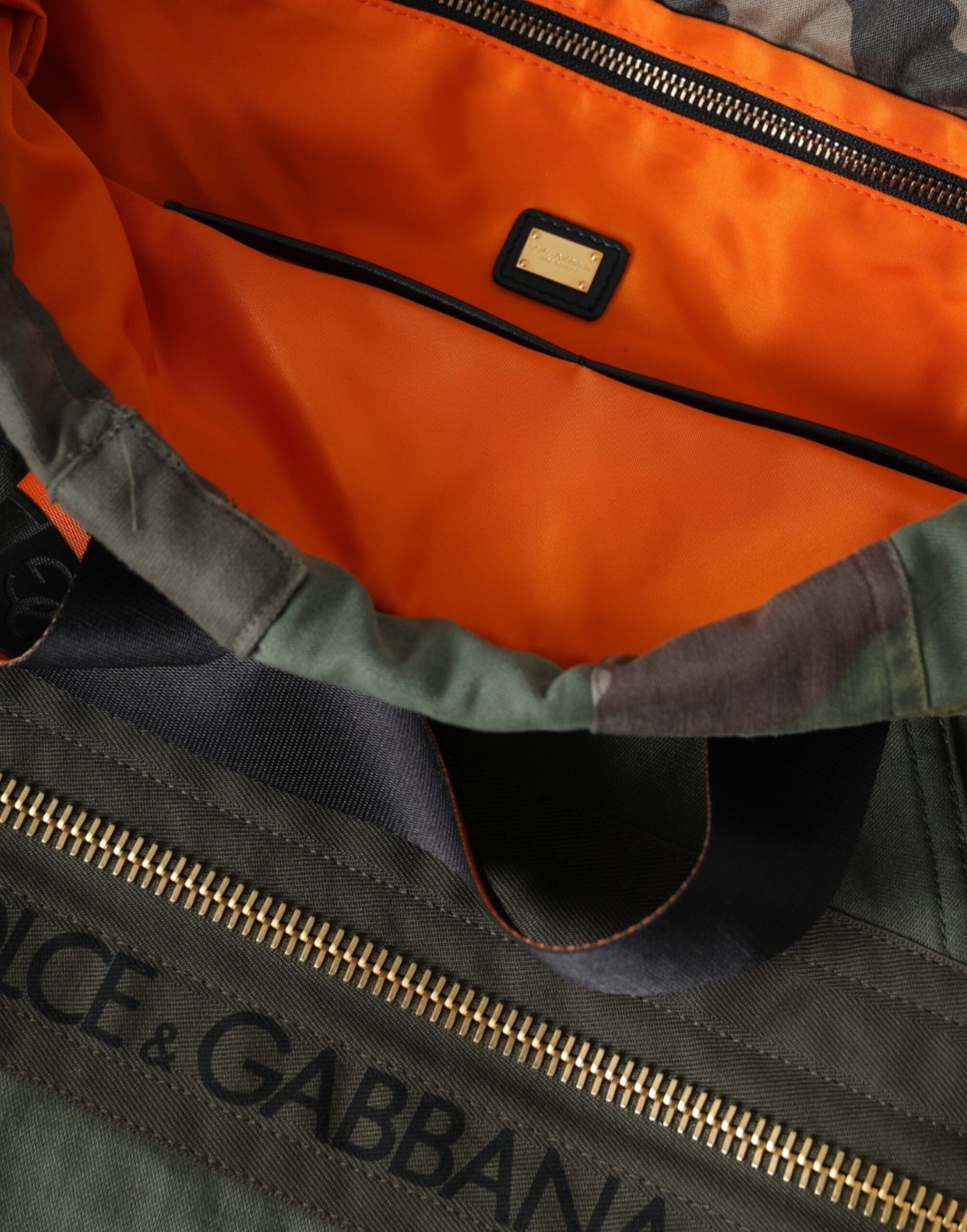 Large Drawstring Rucksack Backpack by Dolce & Gabbana for men in canvas military-green, camouflage & patchwork presents a stately Canvas Large Drawstring Rucksack Backpack design, showcasing a secure drawstring with ample internal-pockets and versatile backpack-strap for a stately finish.