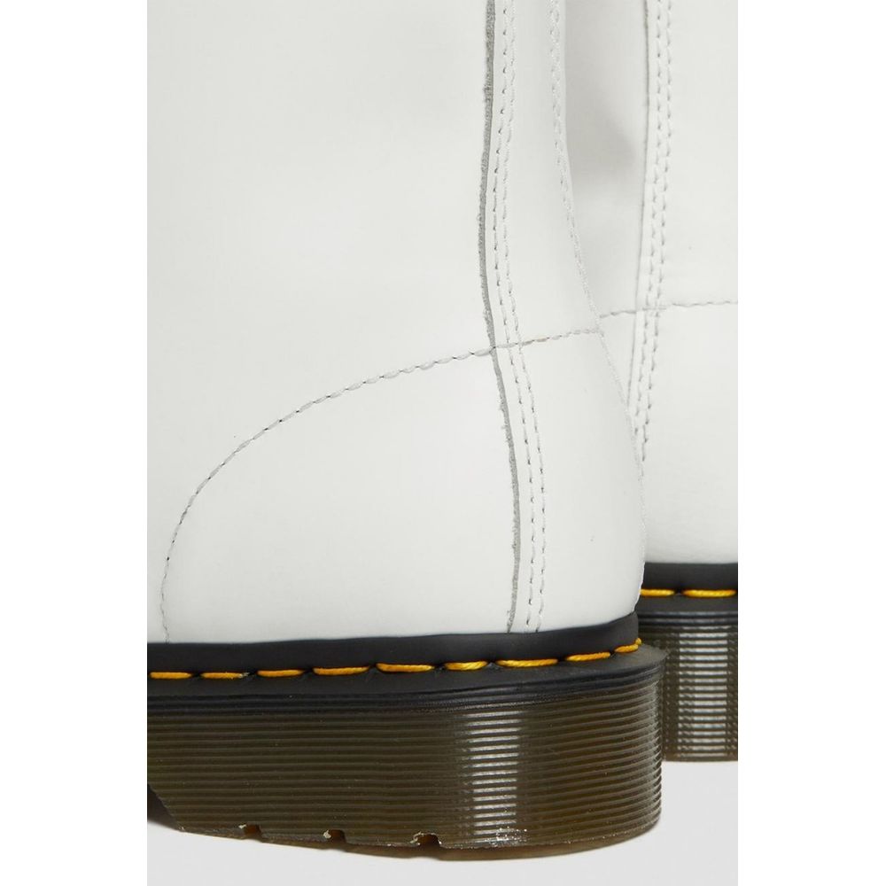 Lace-Up Ankle Boots by Dr. Martens for women in leather & rubber white showcases a ergonomic silhouette from the Women's Leather & Rubber Lace-Up Ankle Boots collection, featuring a ergonomic and a ergonomic .