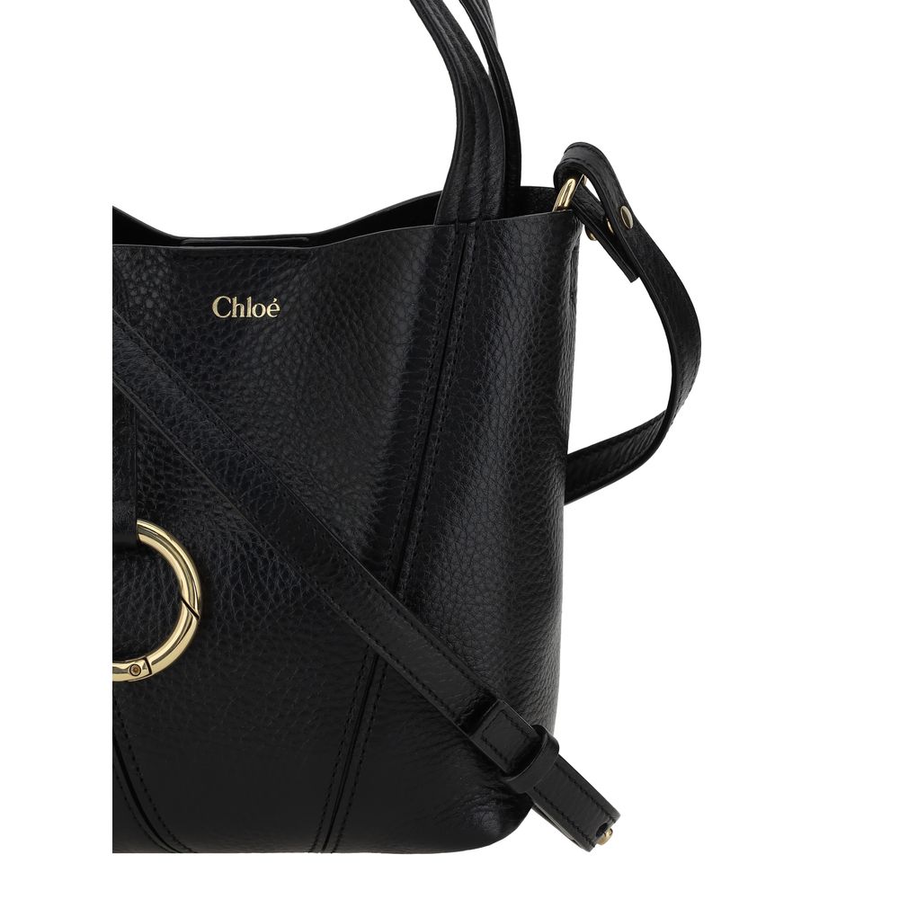 Shoulder Bag by Chloé for women in grained horse leather black & monogram features a effortless chic silhouette with a secure magnetic & button, ample single-compartment, and versatile shoulder-strap, handle & adjustable-strap for a effortless chic finish.