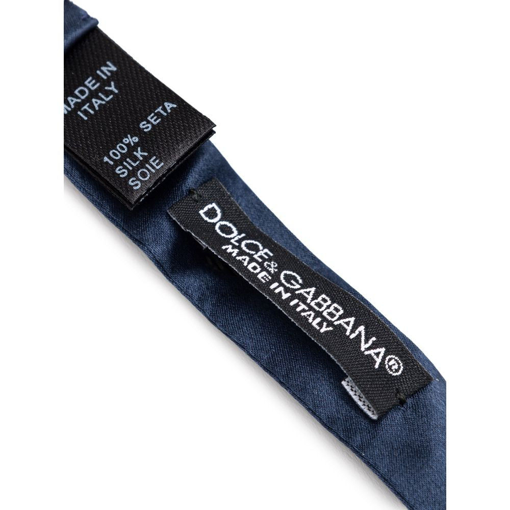 Necktie by Dolce & Gabbana for men in silk blue showcases a stately silhouette, expertly detailed with a stately finish that perfectly captures the sophisticated essence of the Silk Necktie.