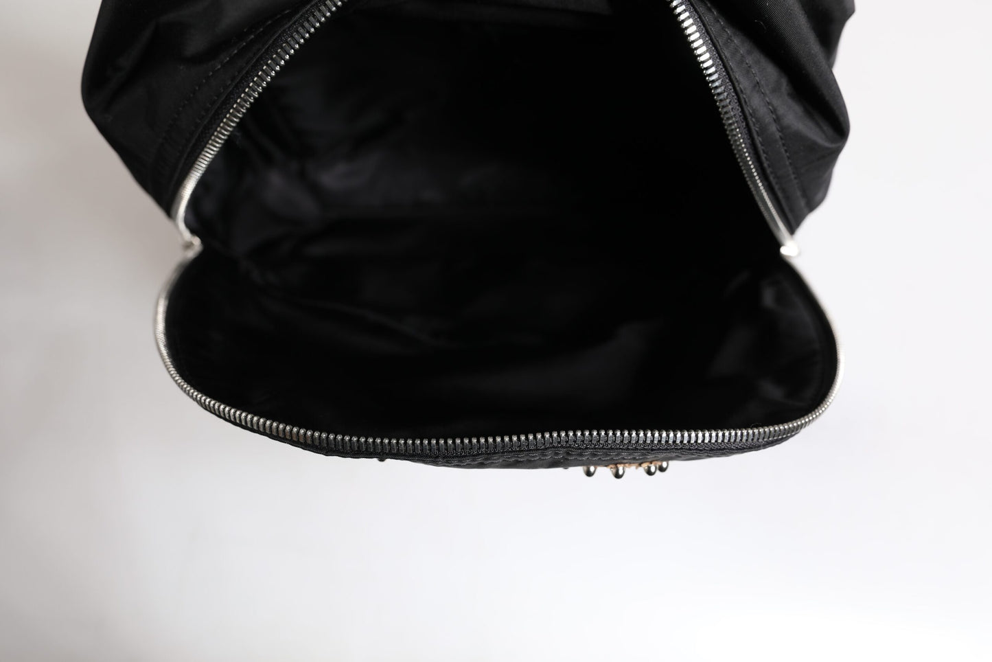 Backpack by Dolce & Gabbana for men in nylon black & signature presents a stately Vulcano Nylon Backpack design, showcasing a secure zipper with ample and versatile shoulder-strap & backpack-strap for a stately finish.