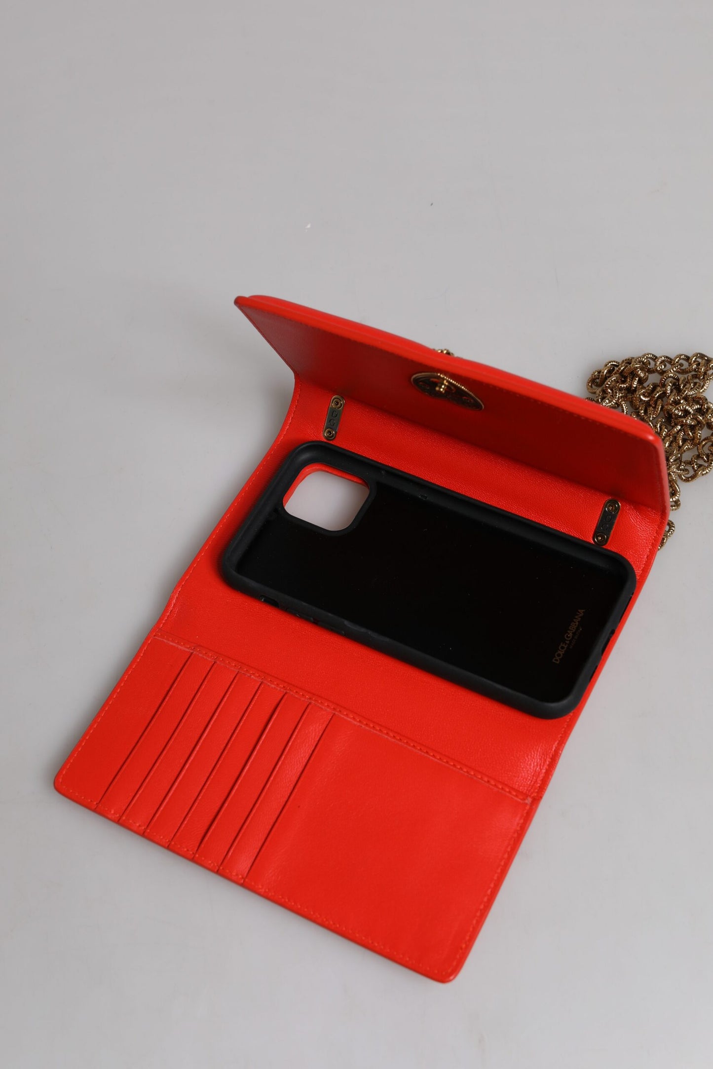 Medium Quilted Crossbody Phone Holder Handbag by Dolce & Gabbana for women in lamb leather gold & red features a transformative sophistication silhouette, showcasing a secure magnetic, ample , and versatile crossbody-strap for a transformative sophistication look.