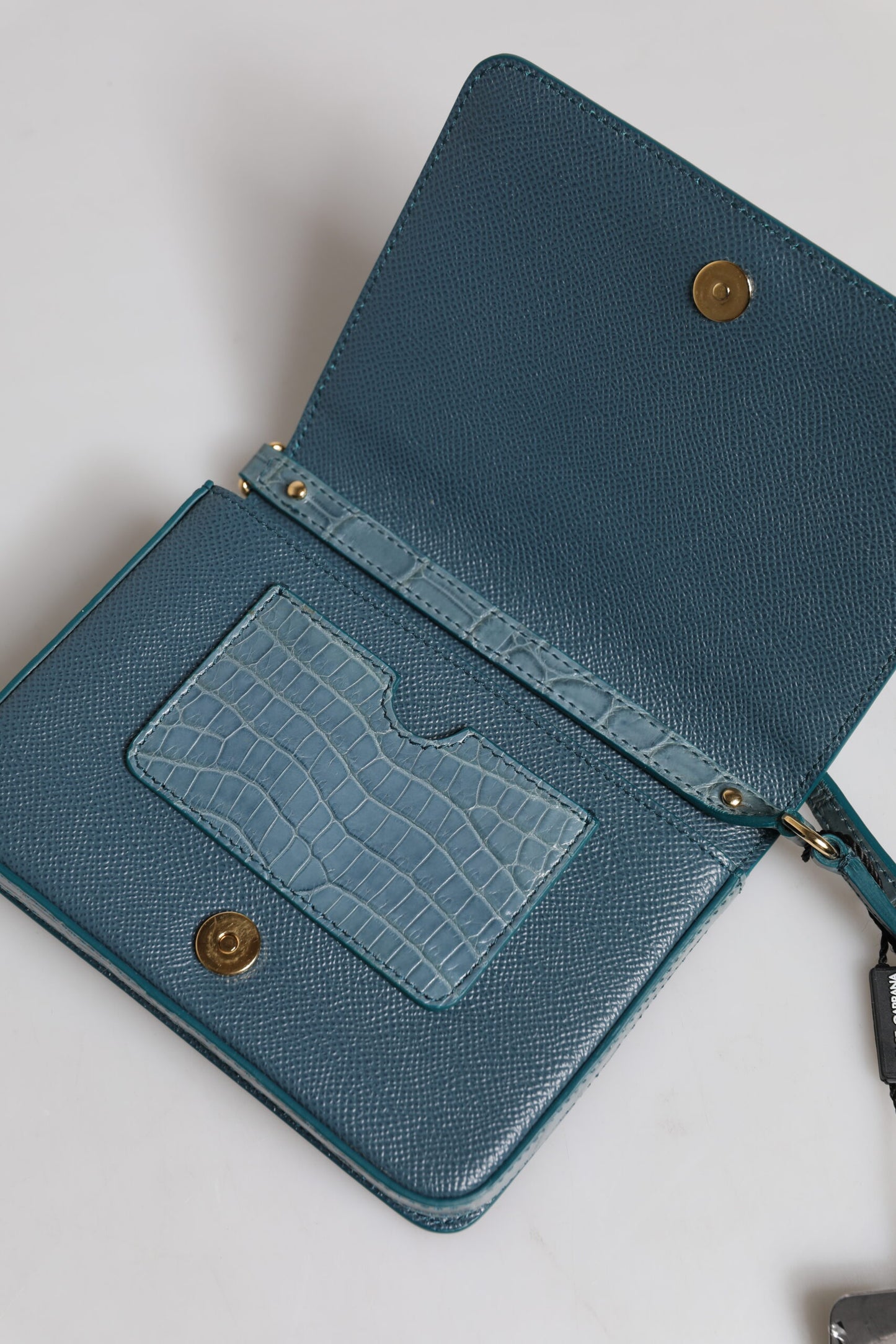 Mini Crossbody Handbag by Dolce & Gabbana for women in exotic leather black, gold & green showcases a versatile sophistication silhouette, featuring a secure magnetic, versatile sophistication internal-pockets & cardholder, and versatile crossbody-strap for a versatile sophistication finish.