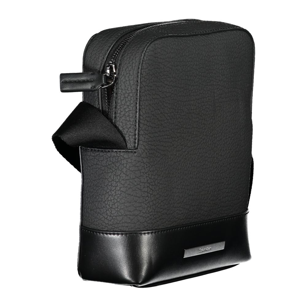 Shoulder Bag by Calvin Klein for men in polyester & polyethylene black features a effortless sophistication silhouette, secured by a zipper with ample external-pockets & internal-pockets and versatile shoulder-strap & adjustable-strap for a effortless sophistication finish.