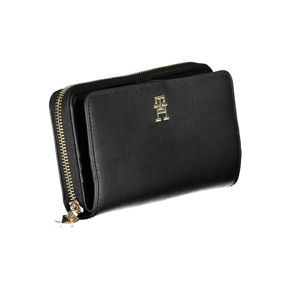 Wallet by Tommy Hilfiger for women in polyethylene faux leather black showcases a refined silhouette, artfully detailed with the signature style of the Polyethylene Faux Leather Wallet and functional compact-design.