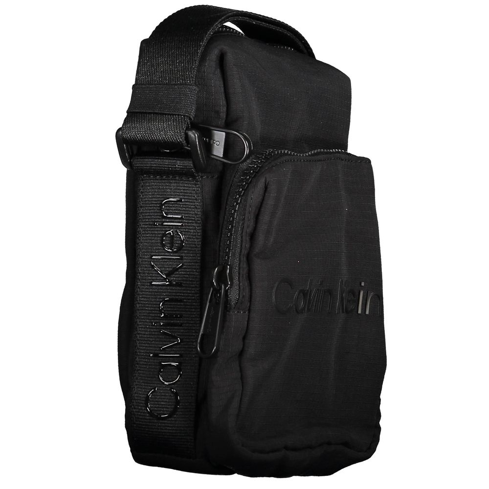 Shoulder Bag by Calvin Klein for men in nylon polyester & polyethylene black features a effortless sophistication silhouette, secured by a zipper with ample external-pockets and versatile shoulder-strap & adjustable-strap for a effortless sophistication finish.