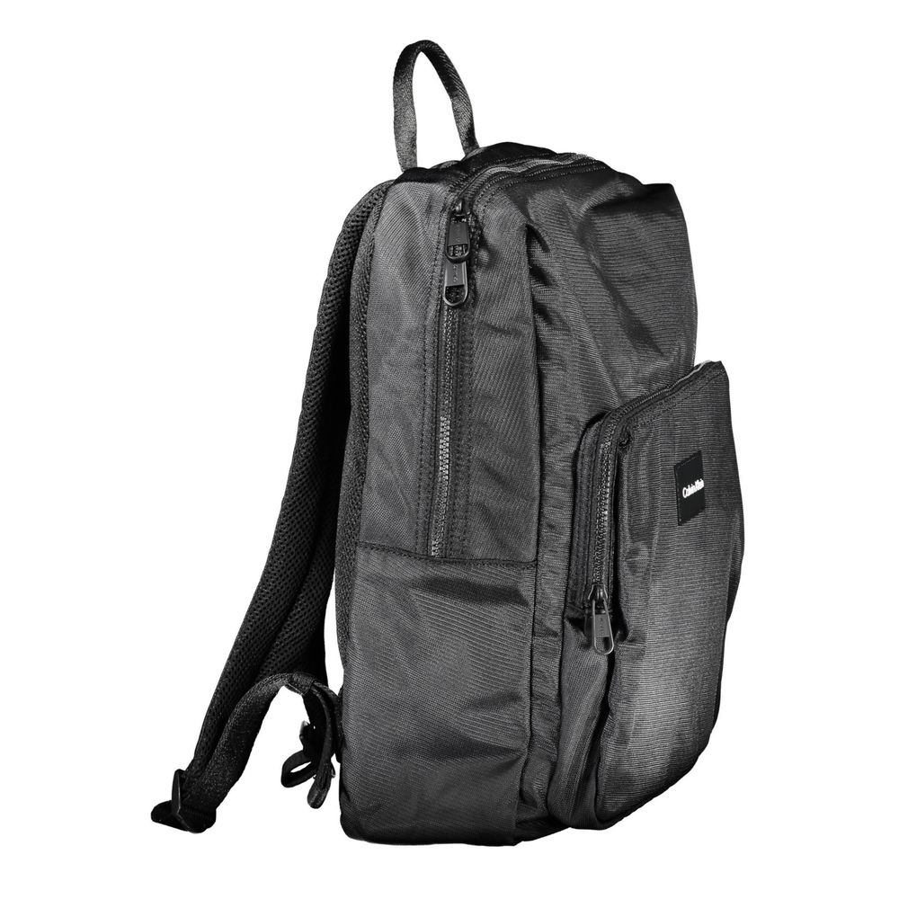 Backpack by Calvin Klein for men in polyester & polyethylene black showcases a stately Polyester & Polyethylene Backpack design, featuring a secure zipper with stately built-in-compartments, external-pockets & laptop-compartment and versatile backpack-strap & adjustable-strap.