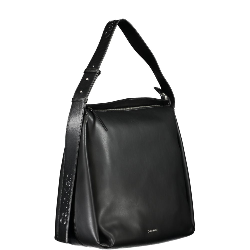 Large Convertible Handbag by Calvin Klein for women in polyester faux leather black features a refined silhouette, showcasing a secure zipper and refined internal-pockets with versatile shoulder-strap, adjustable-strap & handle for a refined finish.