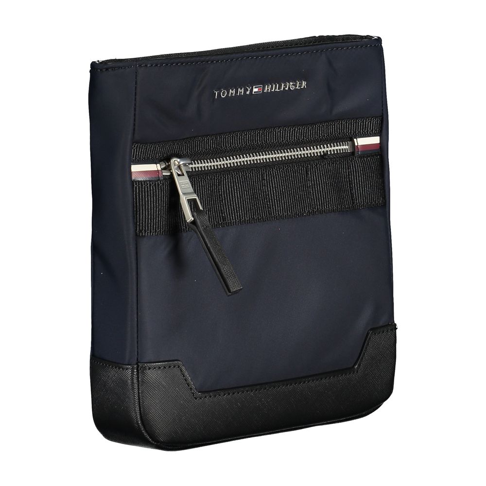 Shoulder Bag by Tommy Hilfiger for men in polyester & polyethylene blue features a stately silhouette, showcasing a secure zipper, ample external-pockets & internal-pockets, and stately shoulder-strap & adjustable-strap for a stately finish.